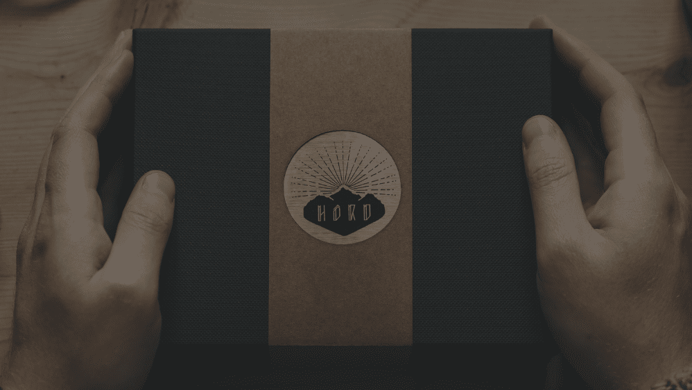 A Hord gift box being received and held in two hands.