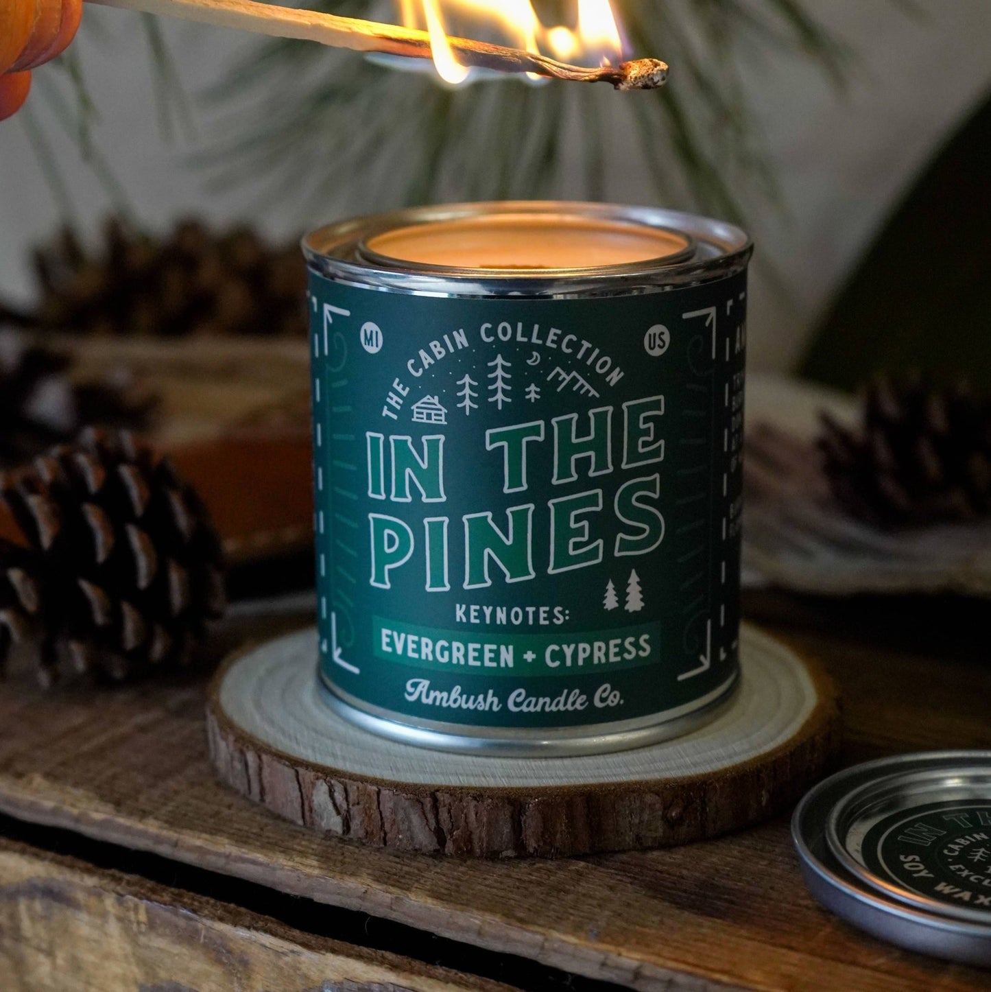 In the Pines wood wick candle with key notes of Evergreen and cypress - cosy environment with the candle being lit