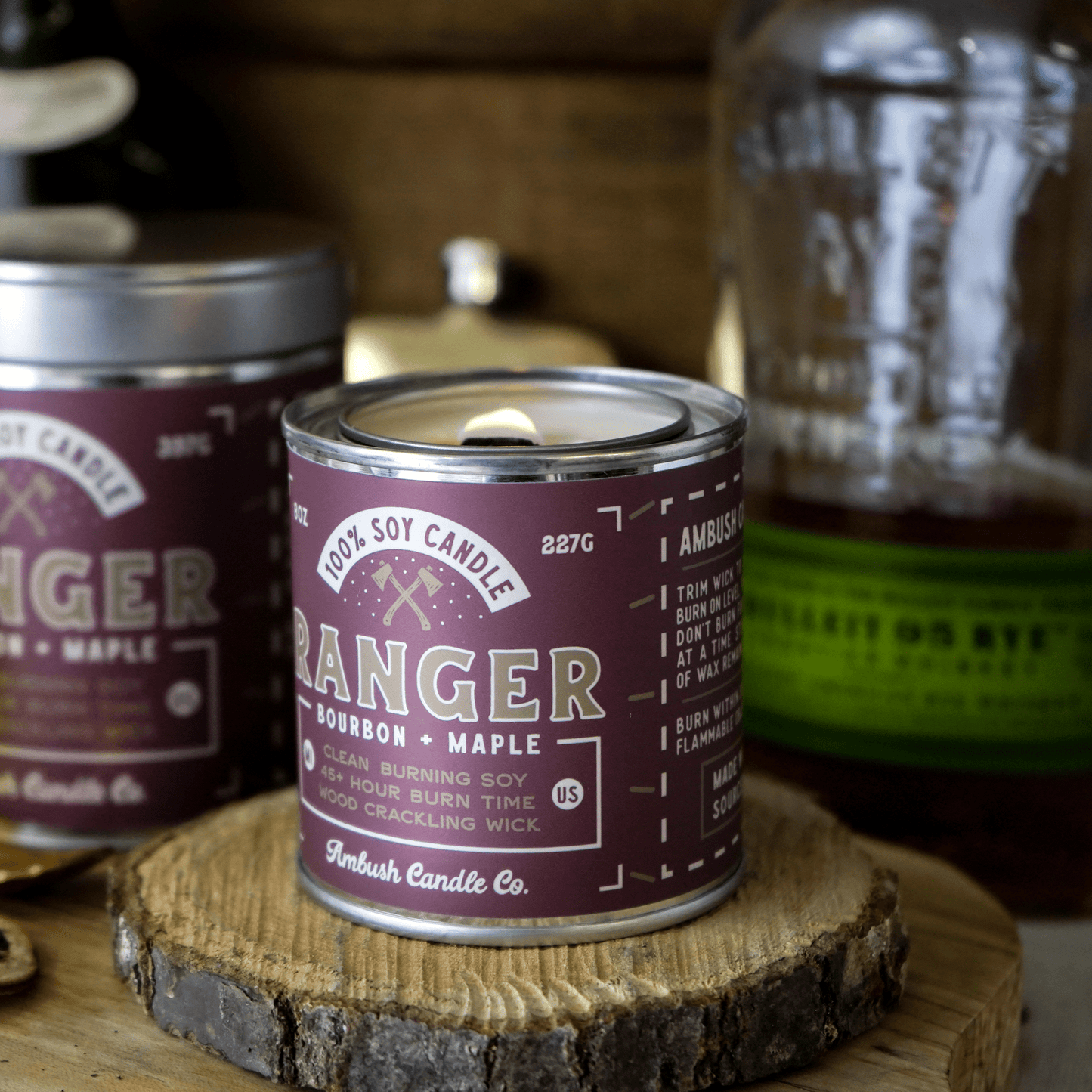 A lit Ranger Bourbon and Maple wood wick Candle
