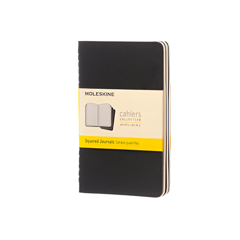 Black Moleskine notebook grid paper on a white background