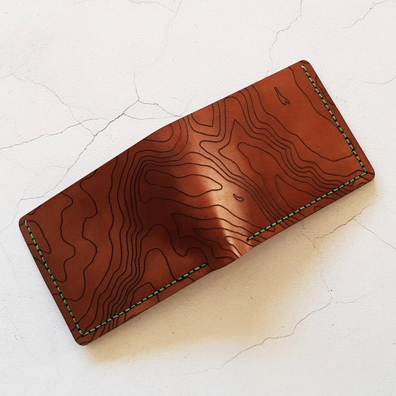 Custom Topography Full Size Mountain Wallet, a personalised designer wallet from Hôrd with the engraving of a custom contour lines. 