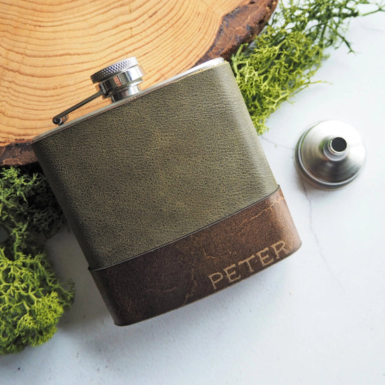 The Moss Leather Flask that has been engraved with a custom name.
