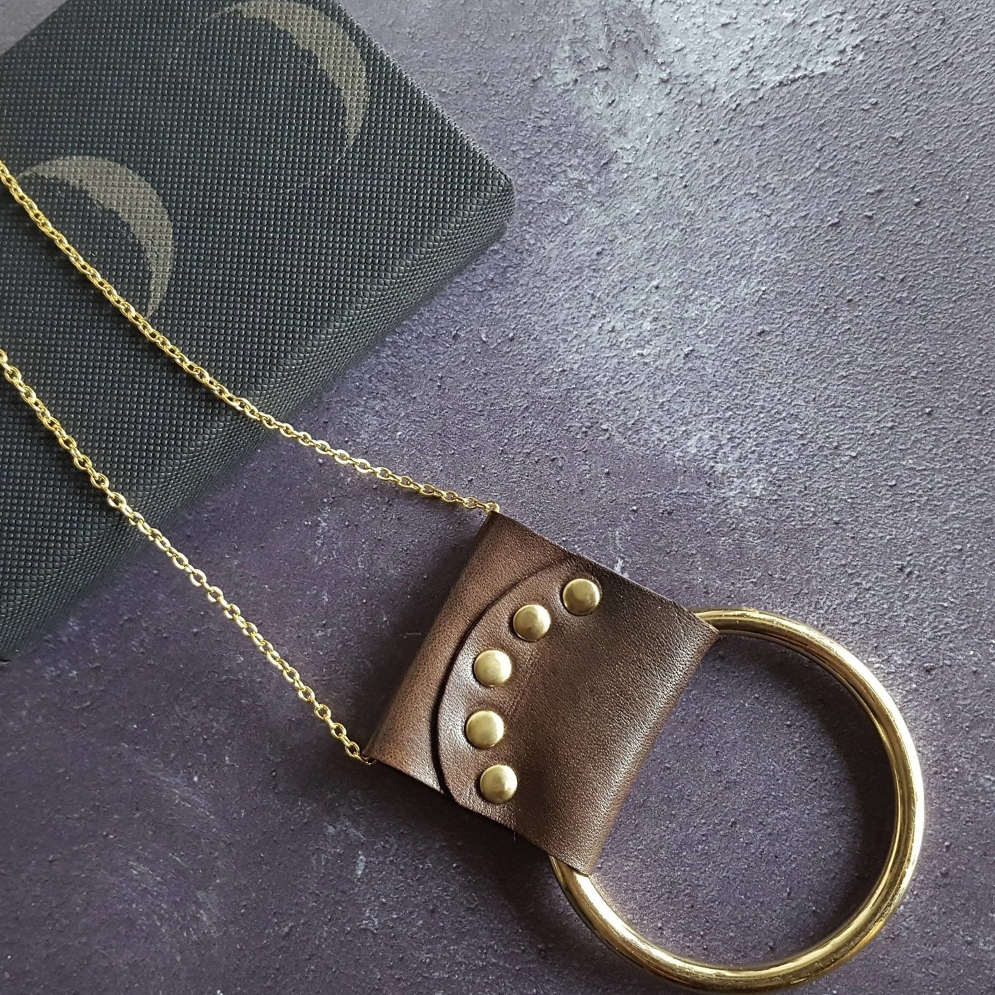 This lunar necklace is the perfect addition to your outfit.