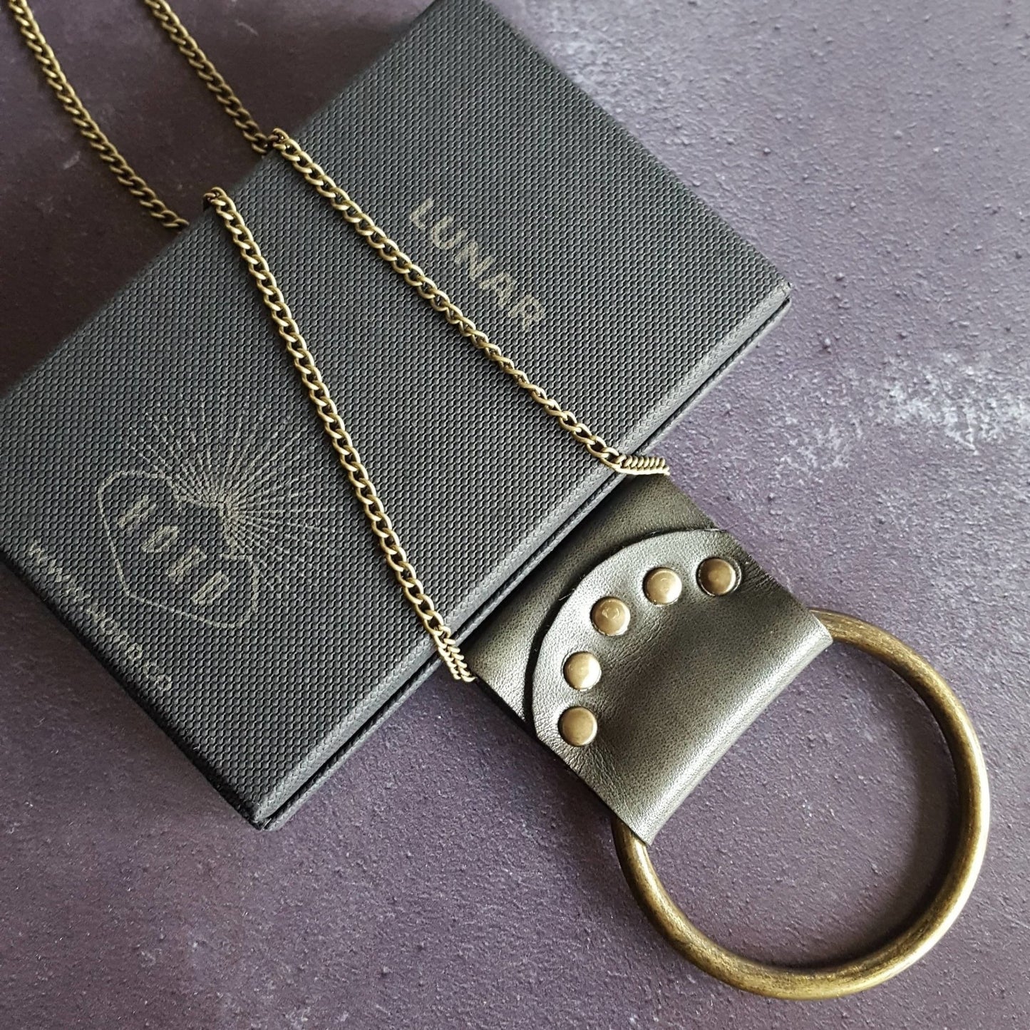 This lunar moon jewelry is made from luxurious leather.