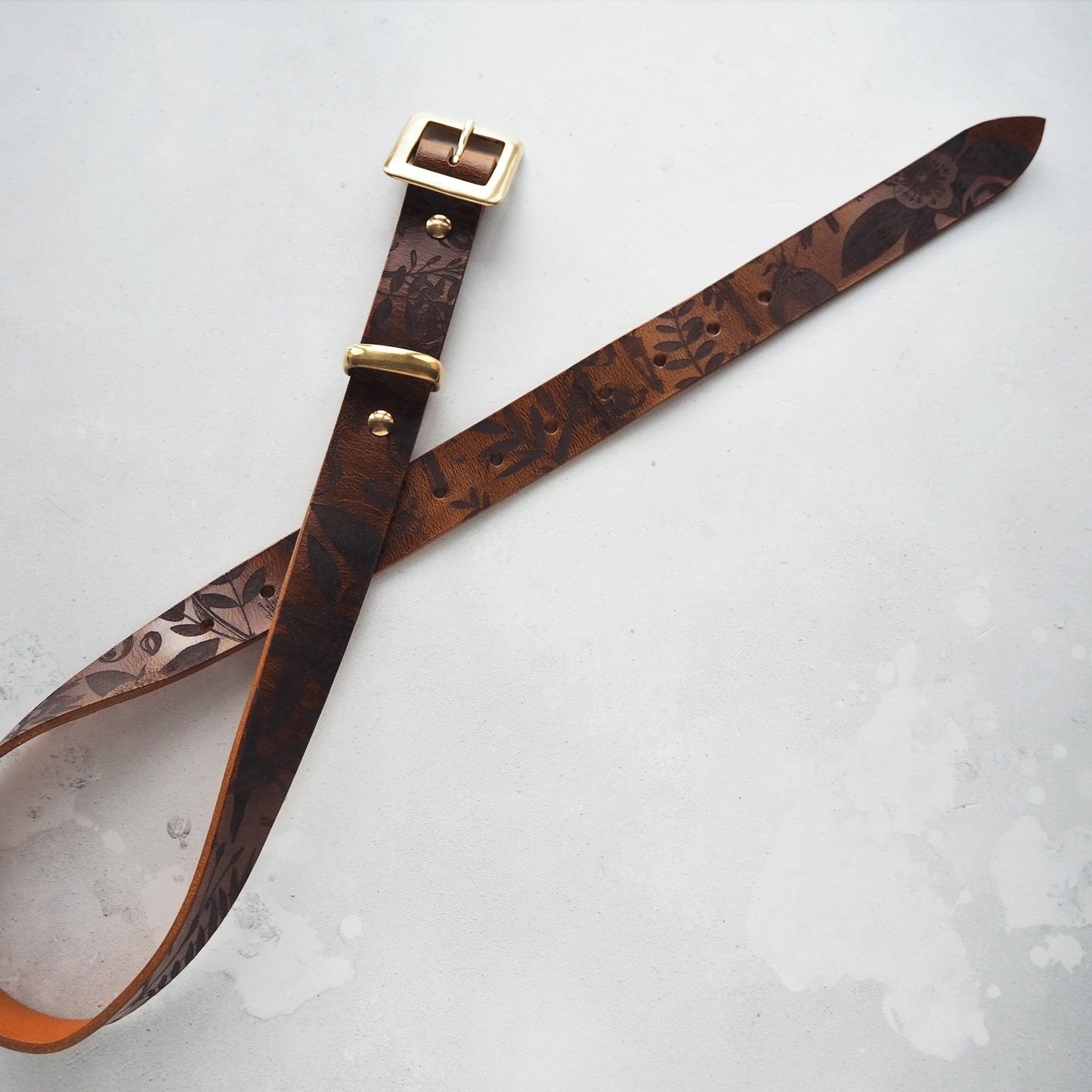 Complete view of th Botanical Leather Belt, a designer leather belt from Hôrd.