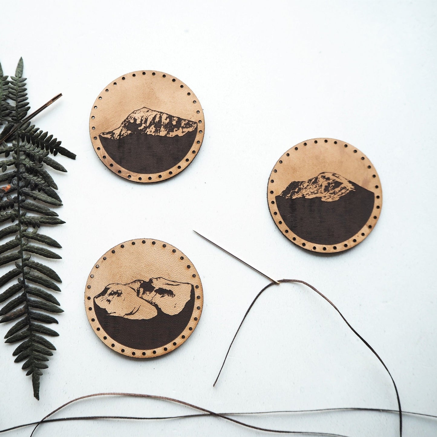 The Hiker Patch by HORD - These leather patches are hand dyed and engraved with the tallest mountains in the UK - Snowdon, Ben Nevis and Scafell Pike. Perfect stocking fillers or gifts for lovers of the outdoors, mountaineering and hiking.