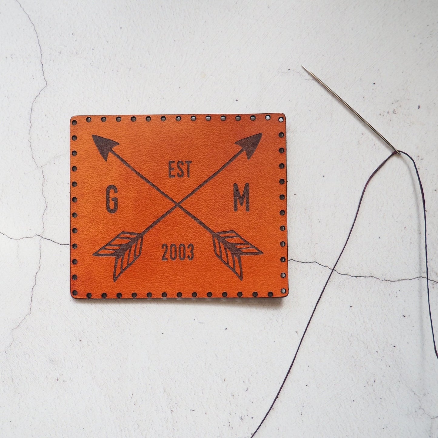 This arrow patch has been engraved with a custom initial and a year.