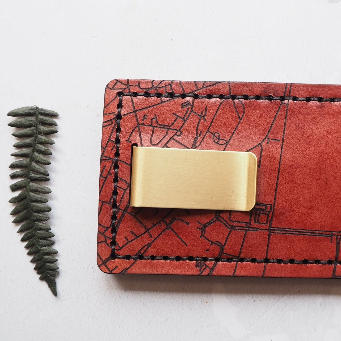 This personalised card holder has been hand stitched with black waxed linen thread.