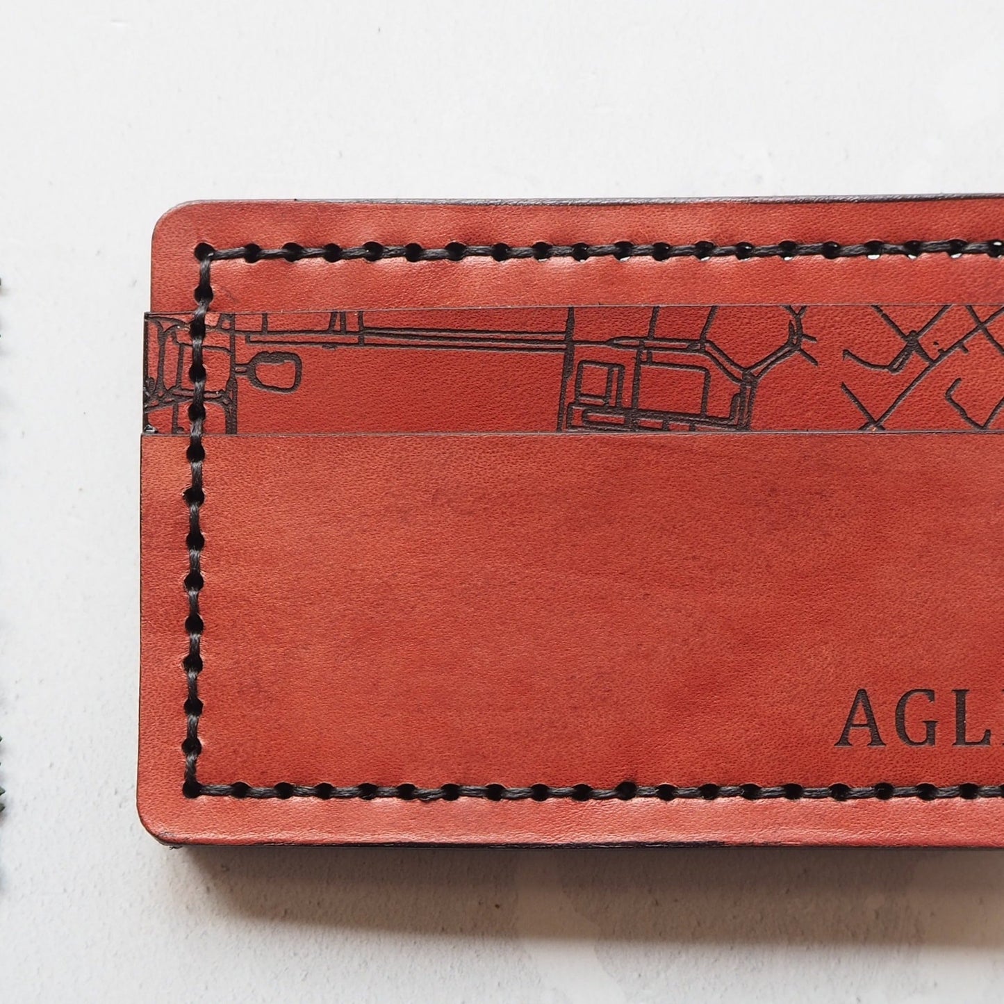 This personalised card holder has 2 compartments which can hold upto 4 cards each.