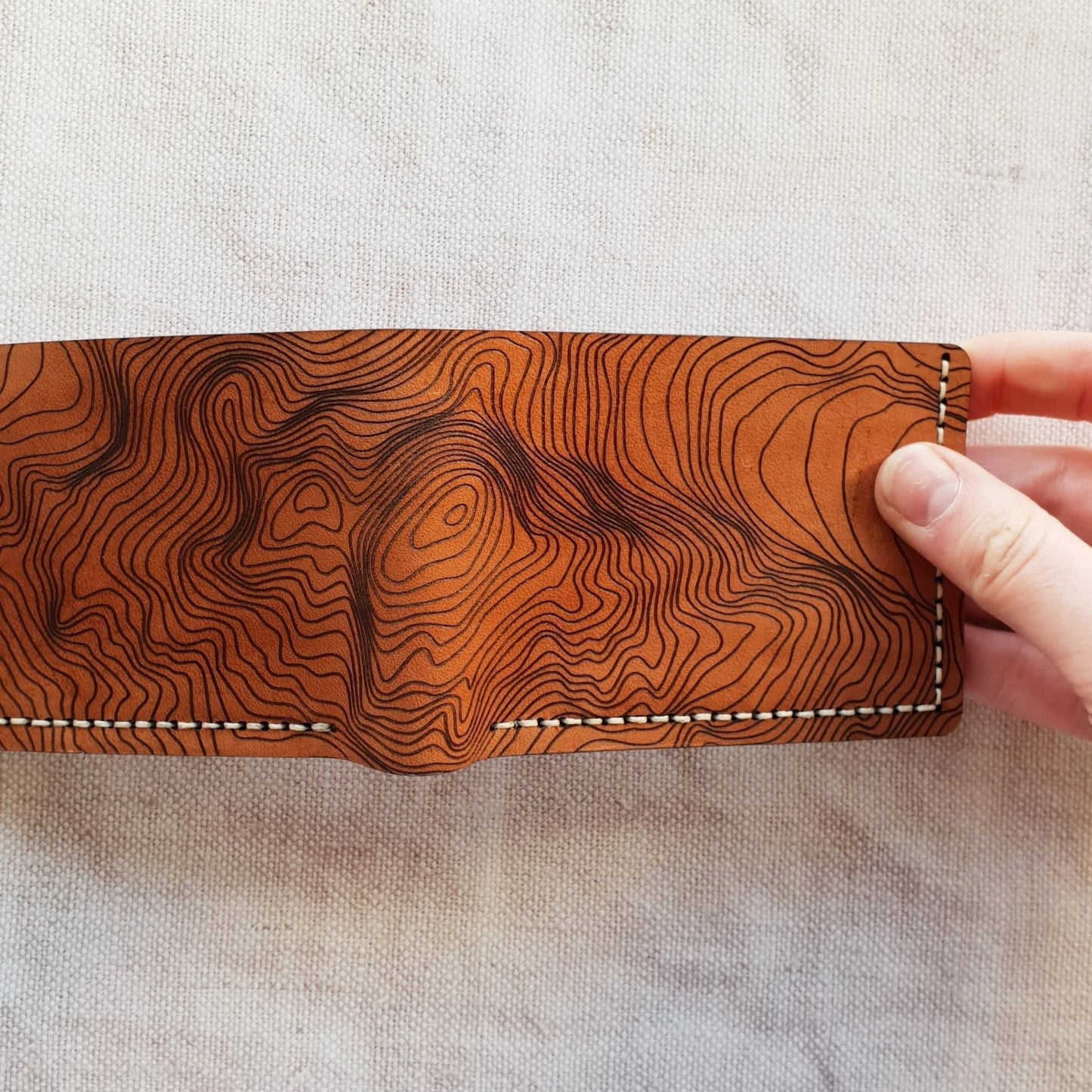 Full view of the Custom Topography Slim Mountain Wallet, an engraved wallet from Hôrd.