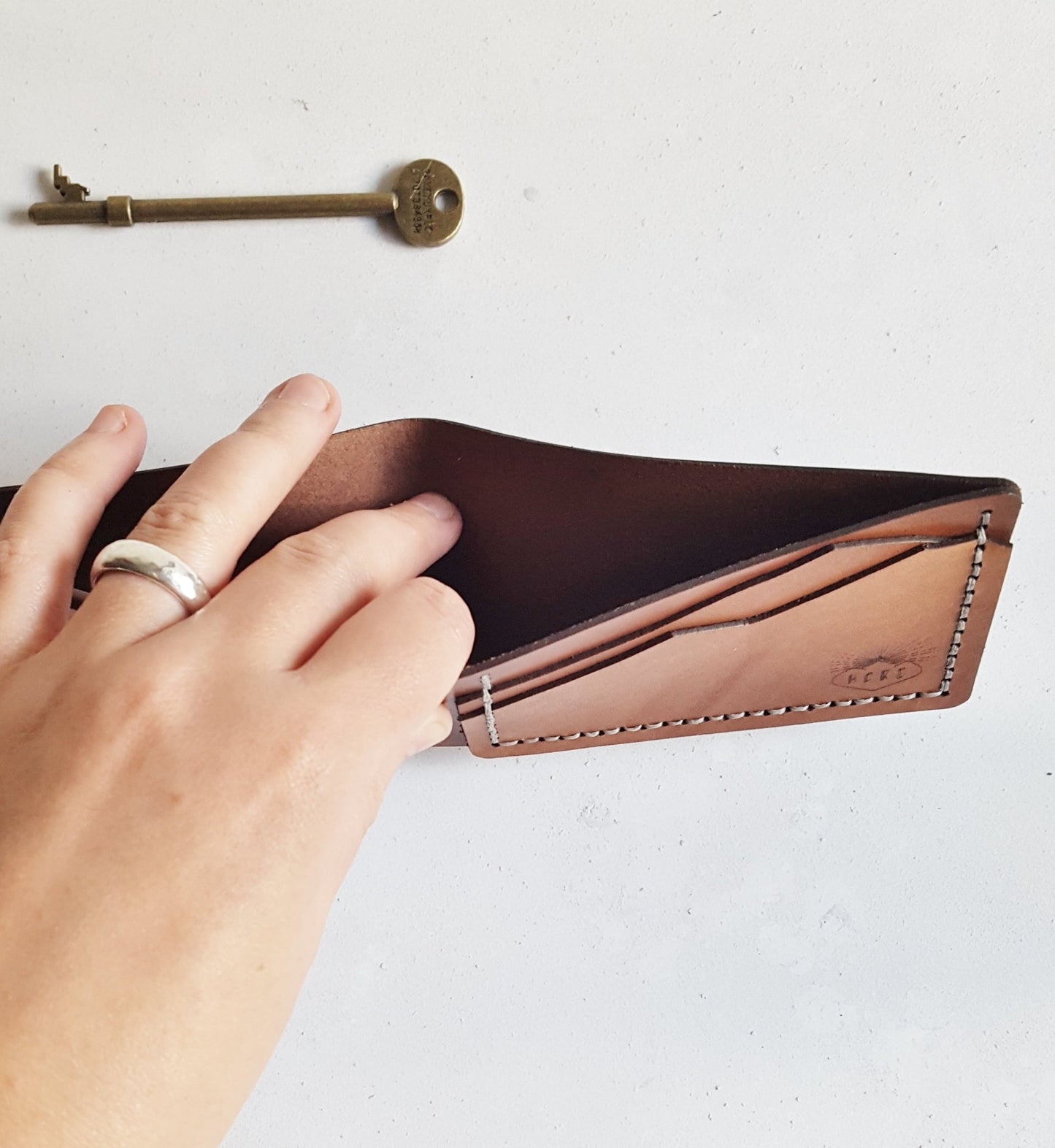 This engraved wallet is perfect for storing your cash and cards. The Custom Topography Slim Mountain Wallet by Hôrd.