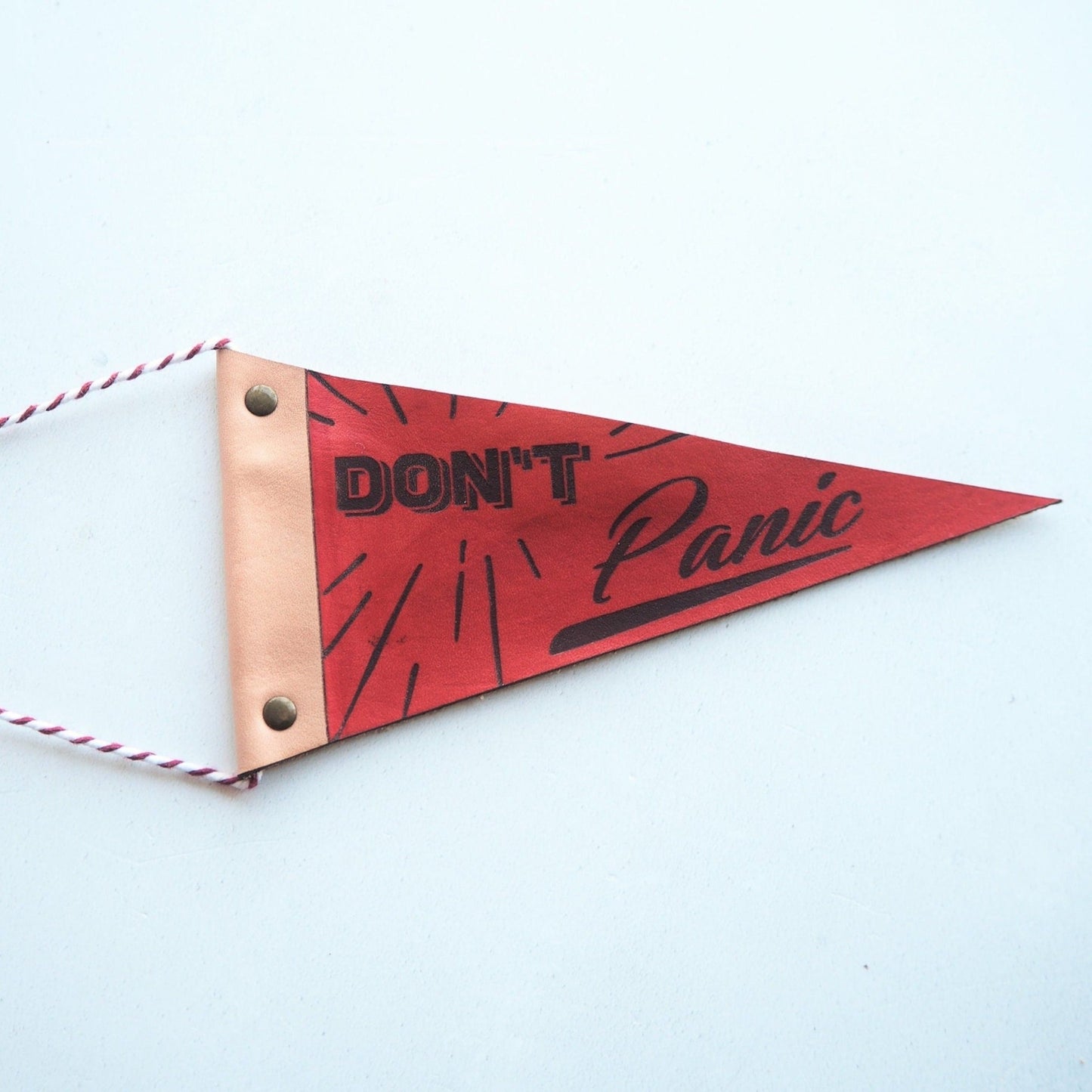 This positive home decor from Hord is engraved with th text Don't Panic, a perfect addition to your home.
