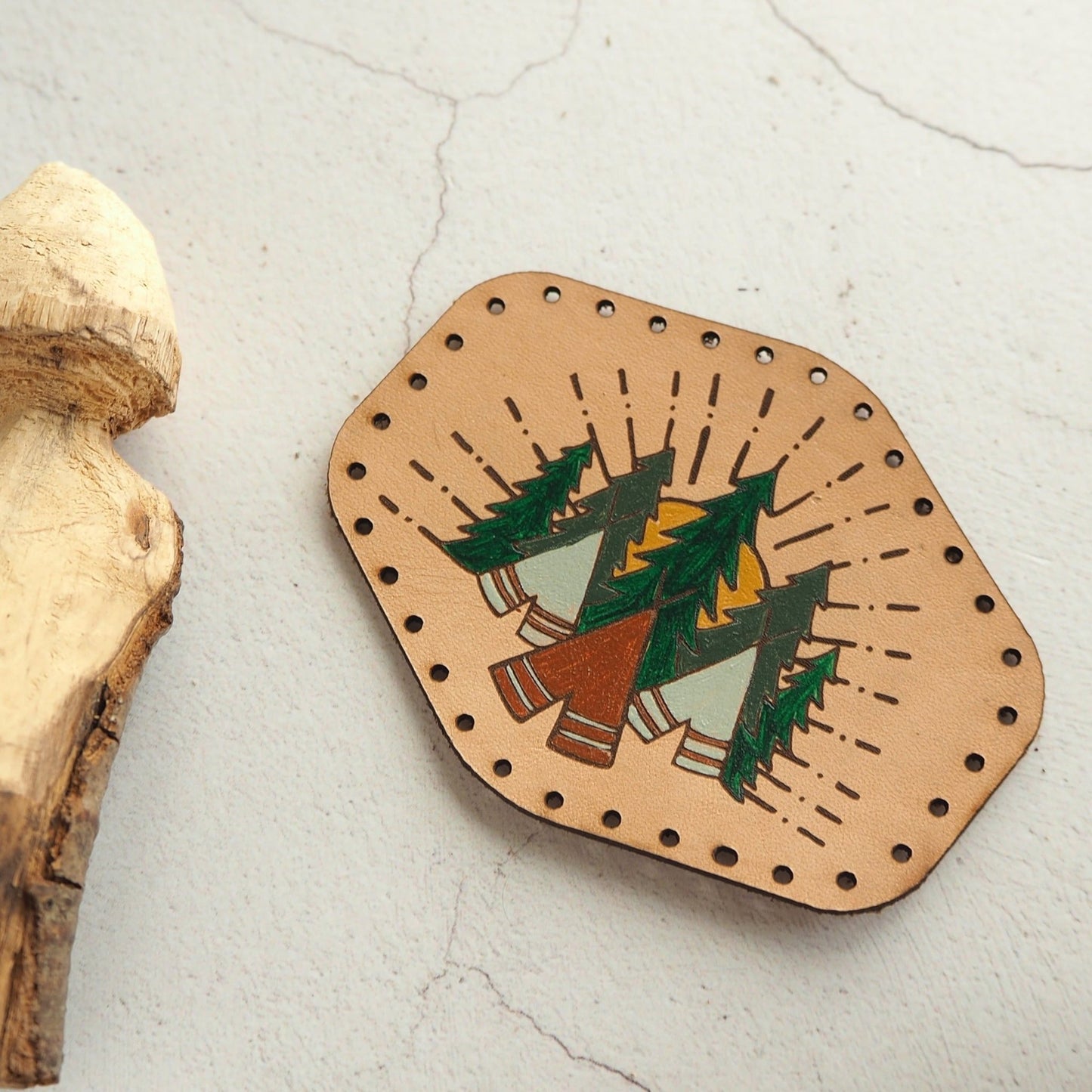 Closer look at the engraving and painting of the camping patch.