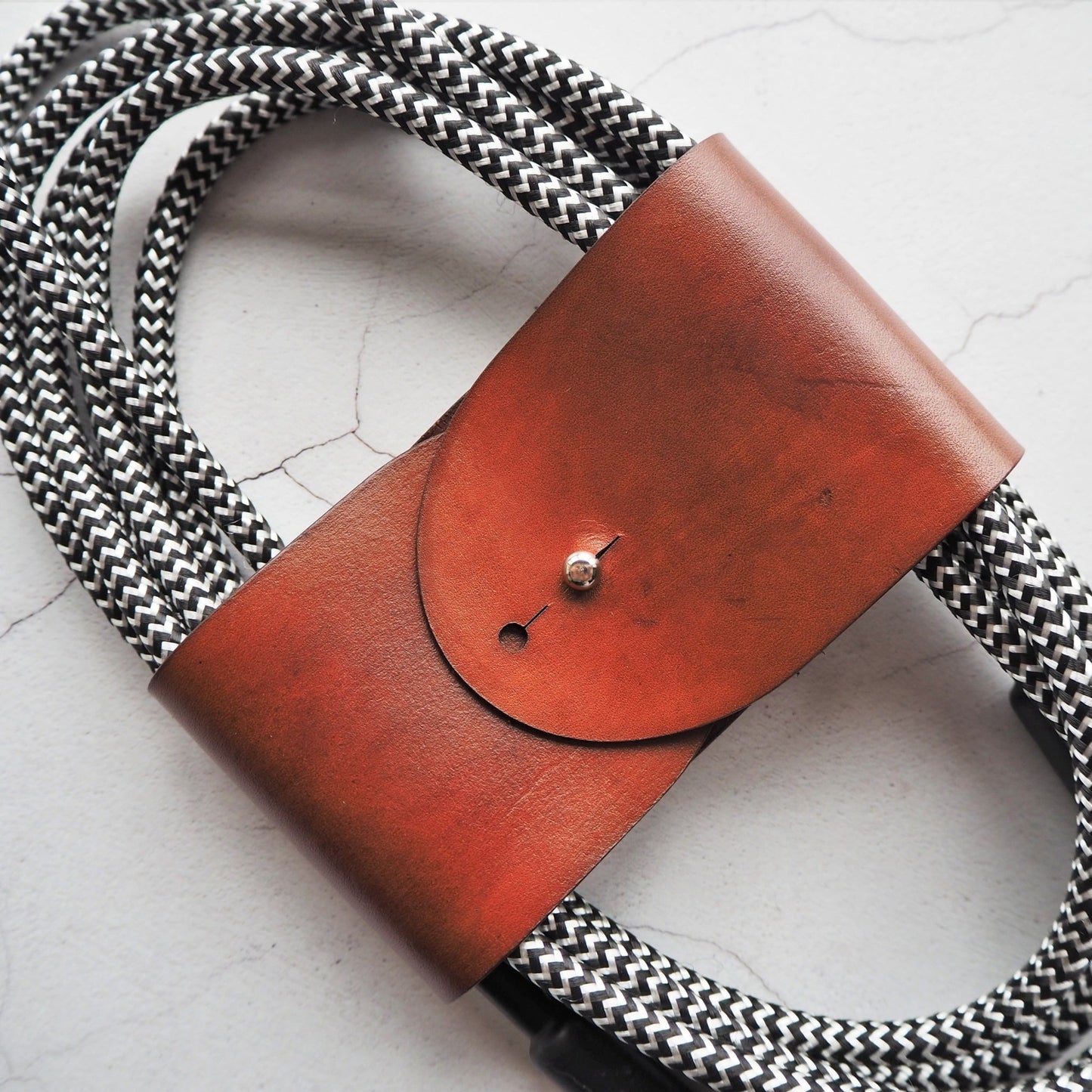 A guitar cable neatly wrapped with using HÔRD's guitar cable tidy.