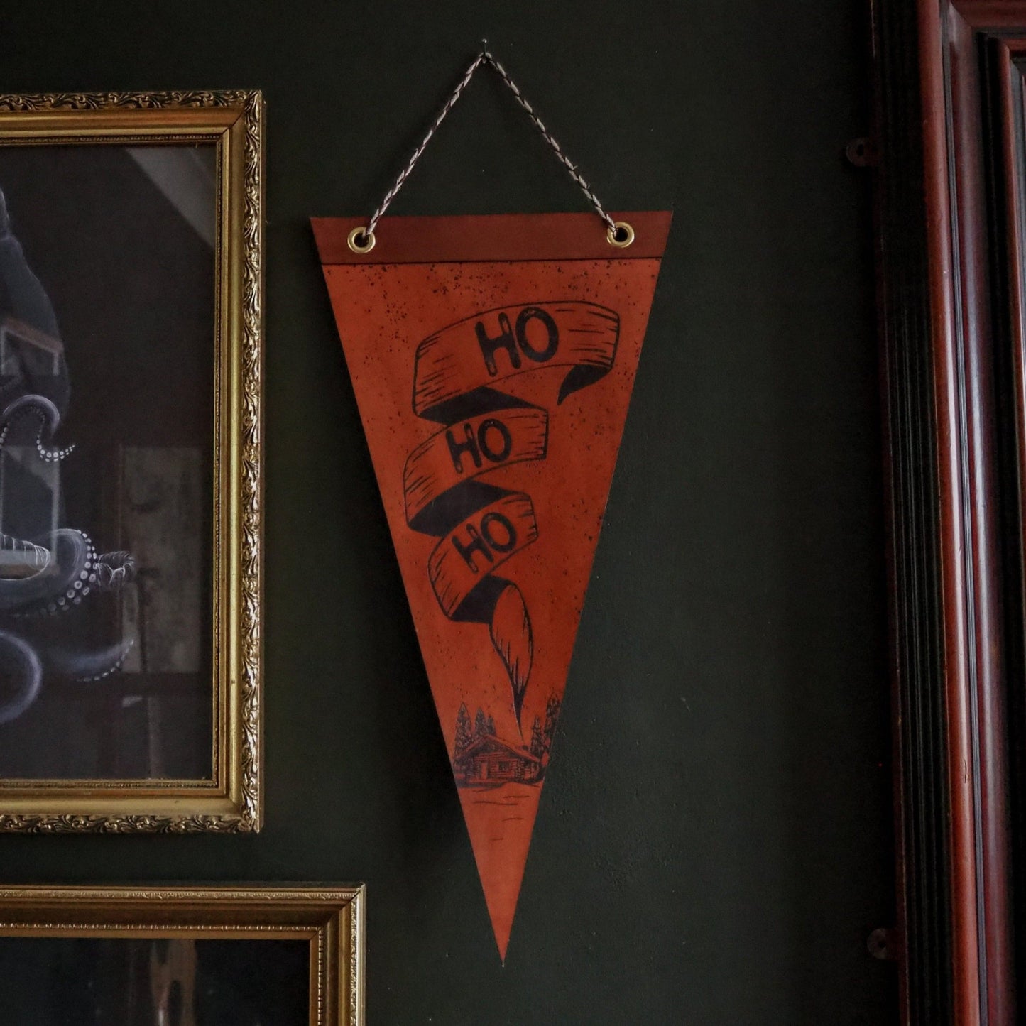 The Ho Ho Ho Banner hung on a wall, a large christmas banner from Hord.