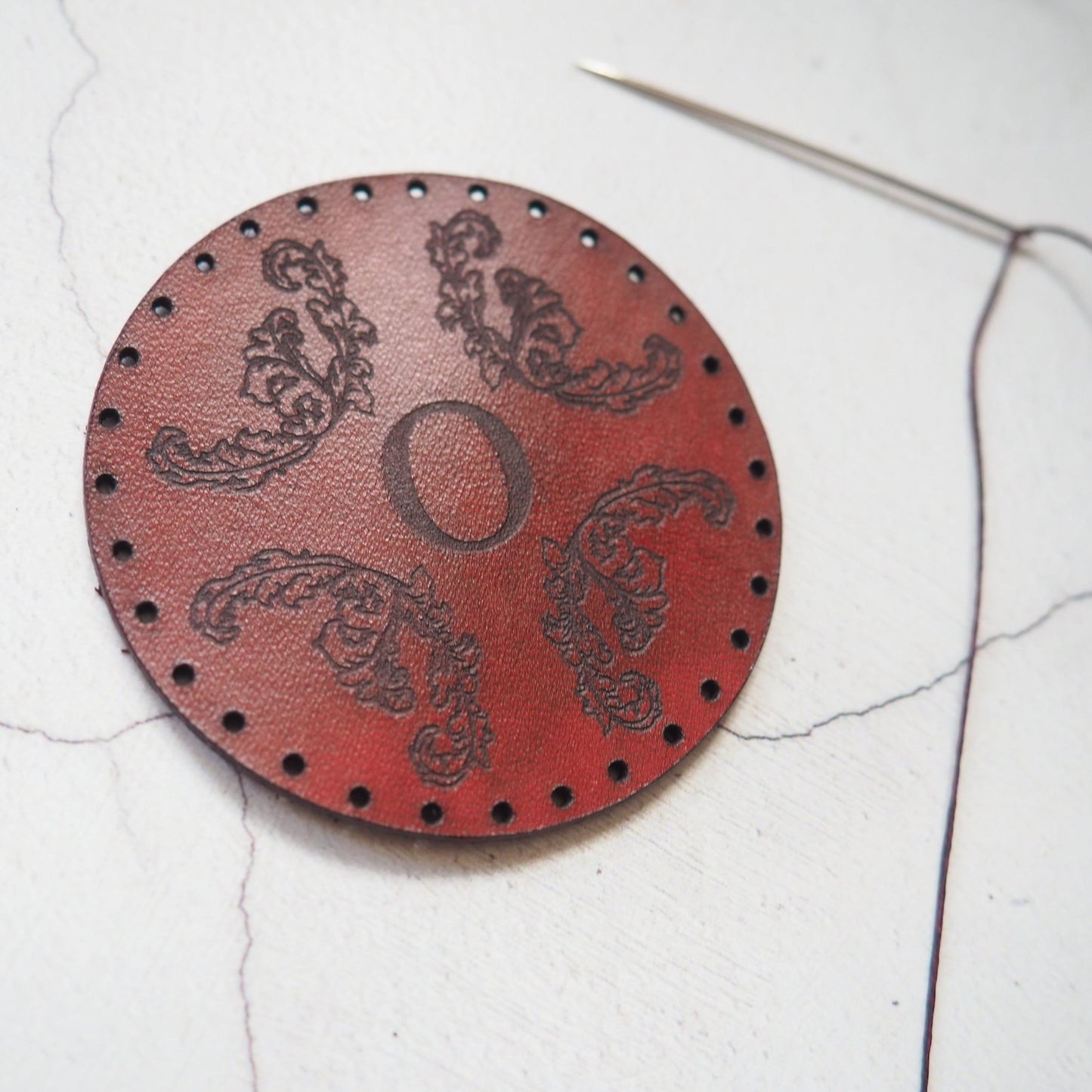 This design patch comes with pre-cut stitch holes ready to be stitched.