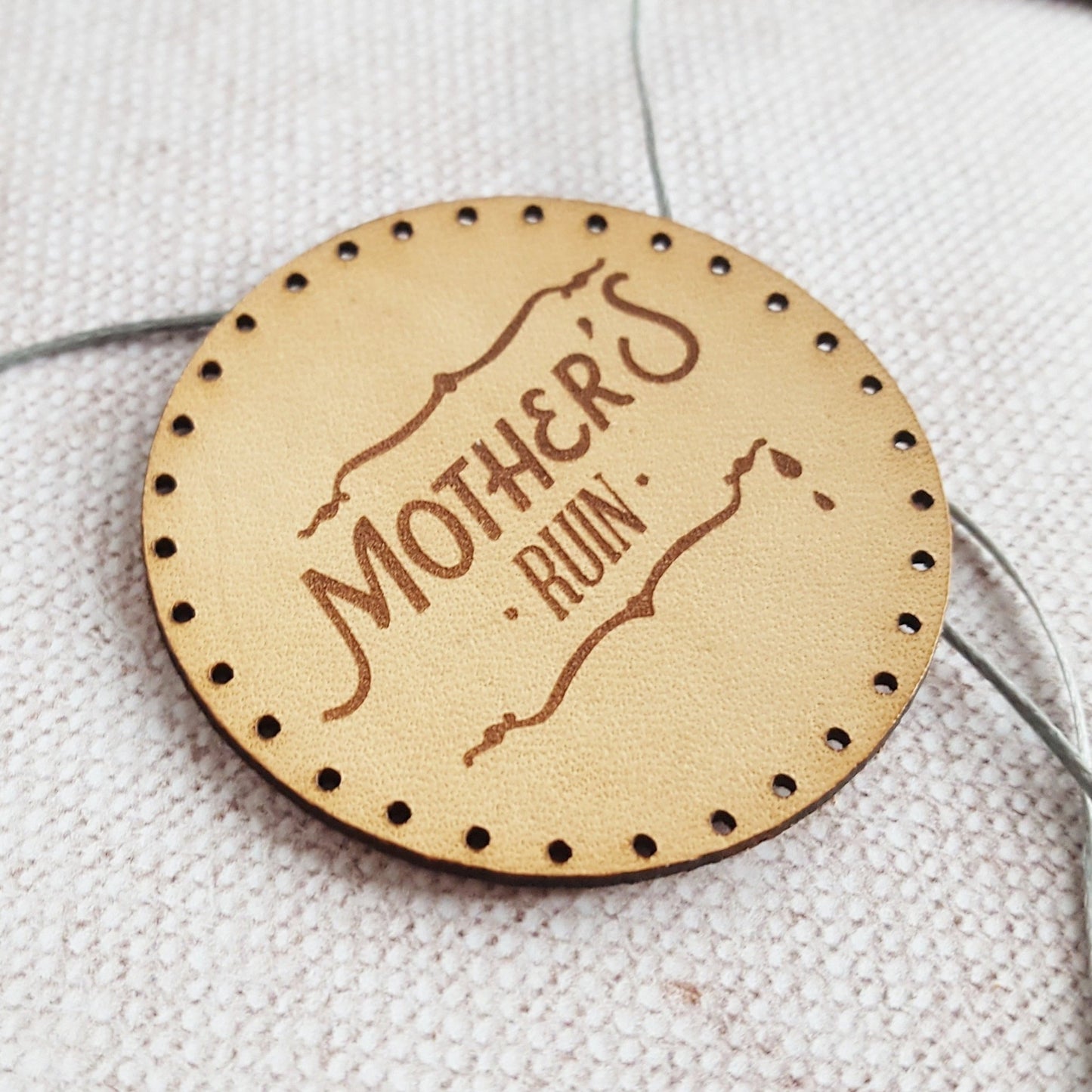 A close up of the HORD 'Mother's ruin' patch with unique typography and tear drops - the perfect gift for people who love gin. The Gin Patch from Hord.