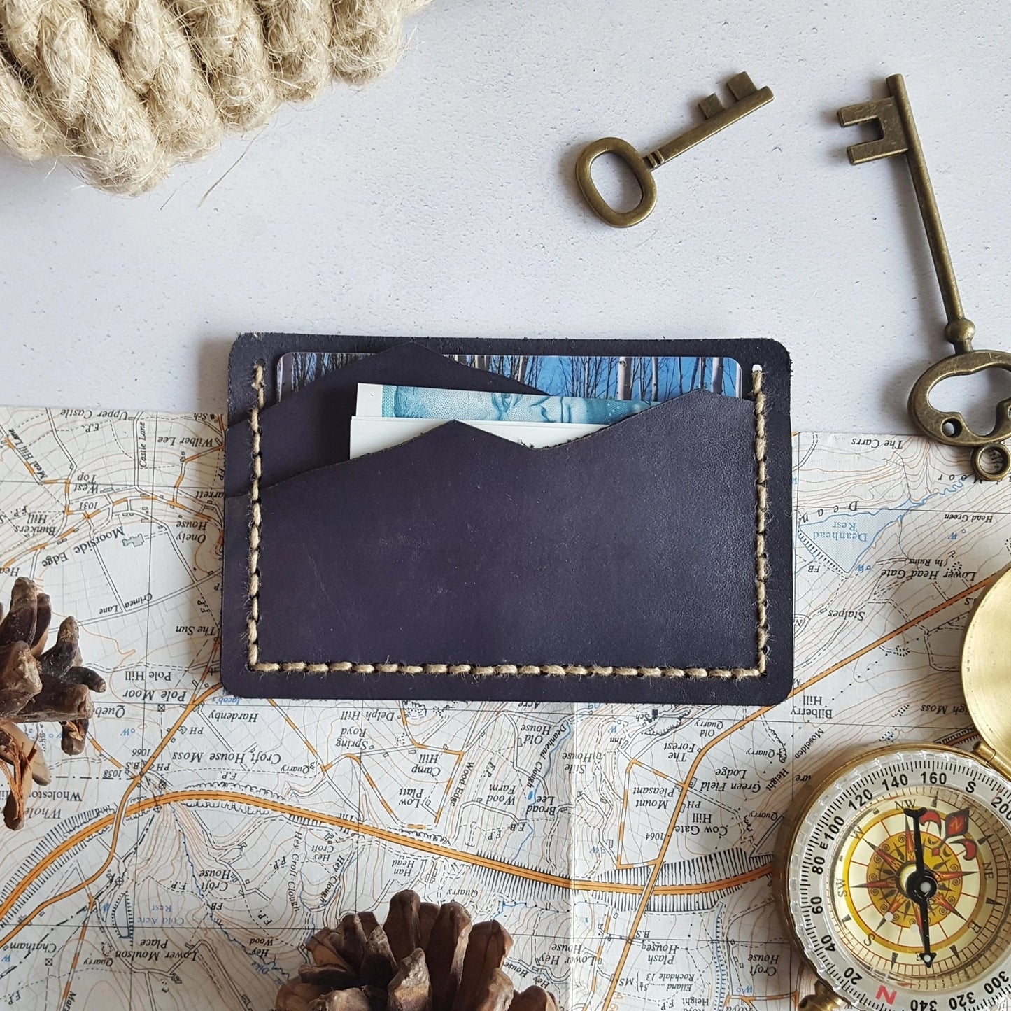 This leather card holder from Hôrd, the Mountain Card Holder has two compartments which can keep ahold of your cards and cash.