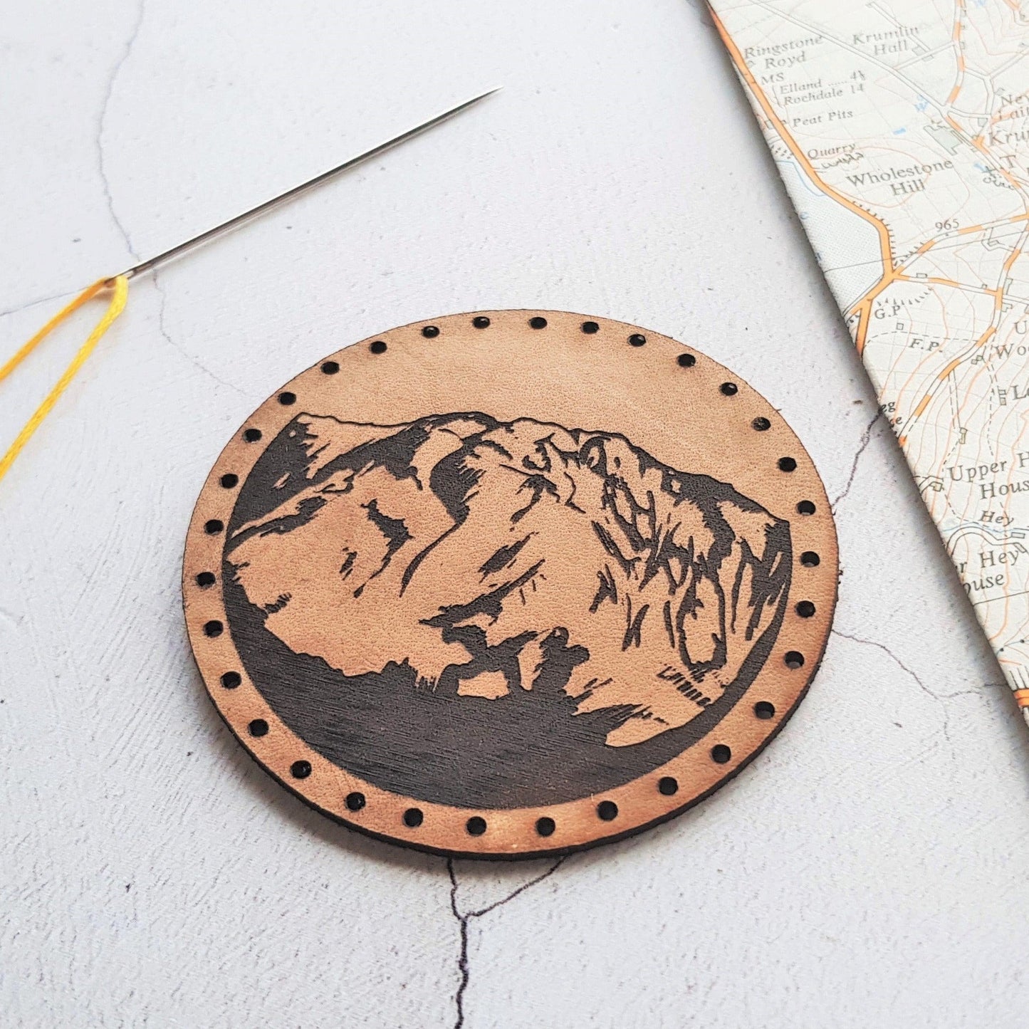 The Mountain Patch by HORD comes with pre cut stitch holes make this easy to sew onto your hiking bag or woolly hat.