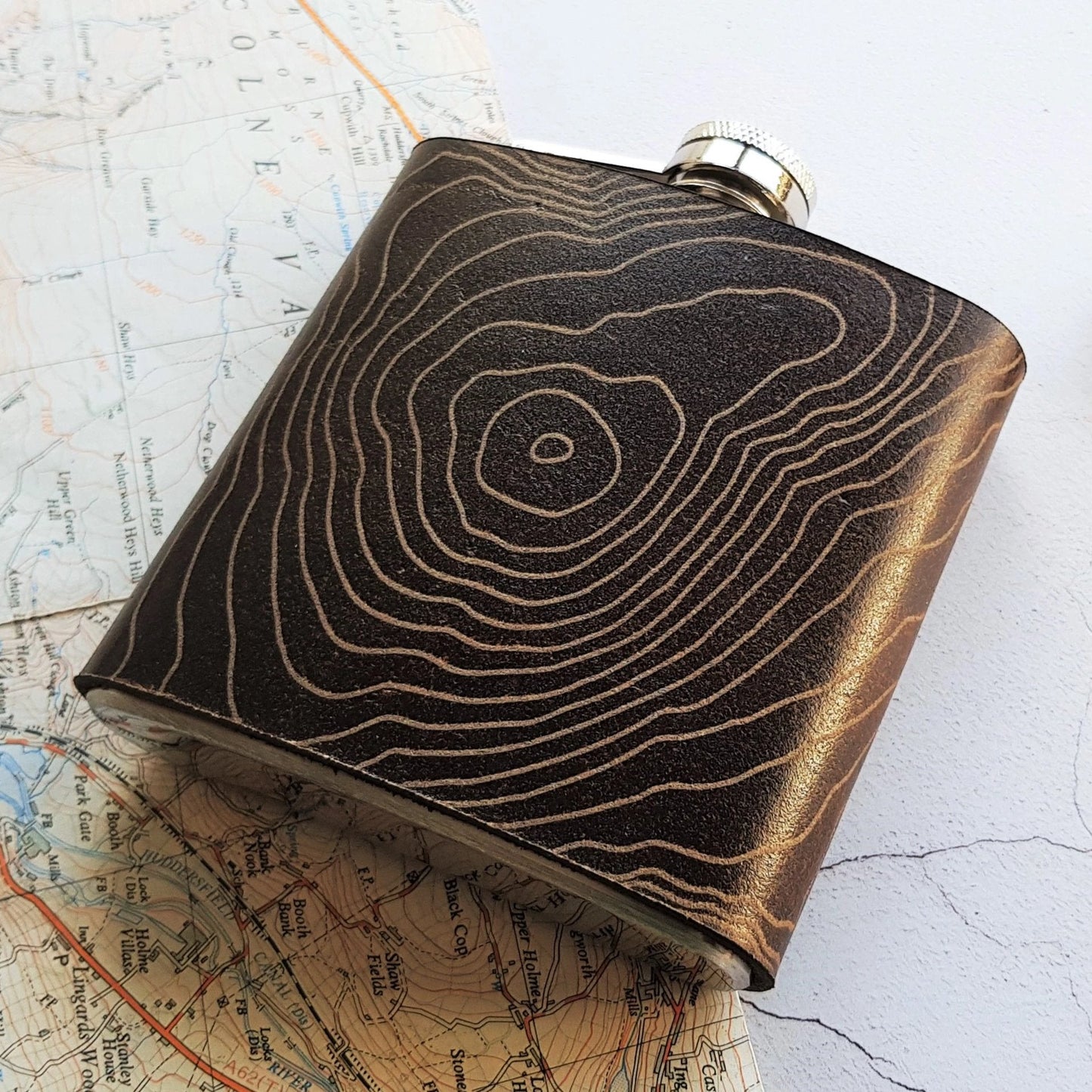 This bespoke hip flask is engraved with the contour lines of your favourite and special place.