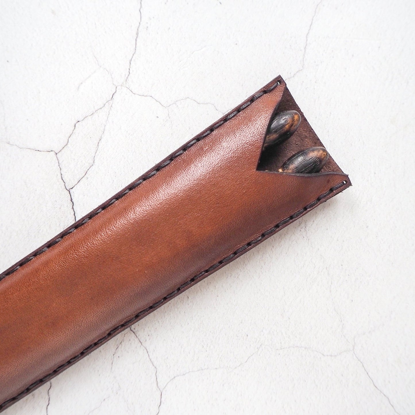 Drumsticks that are safely put into the Rune drumstick holder, a drumstick holder offering from HÔRD.
