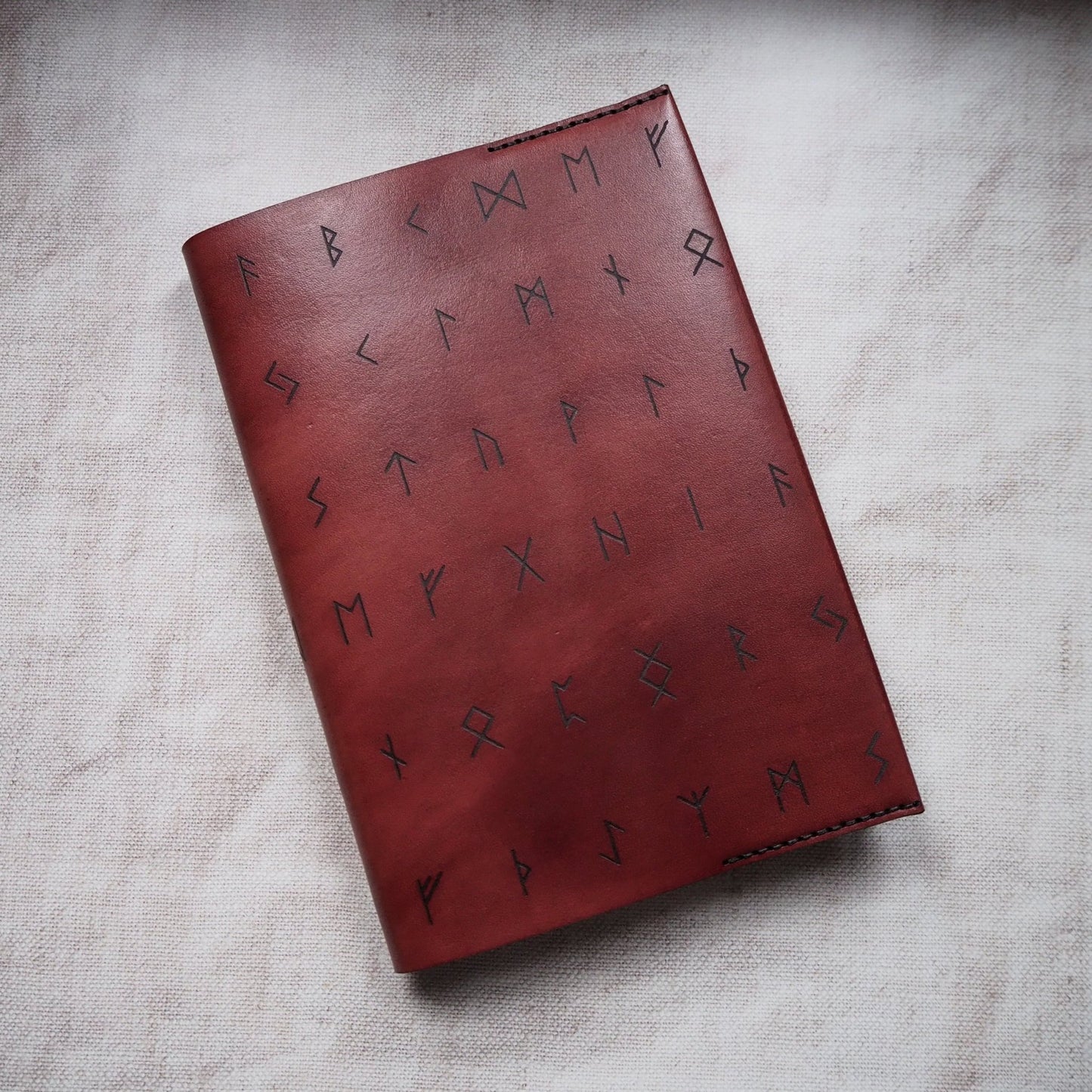 The Rune Leather Notebook Cover by HÔRD hand dyed on bordeaux leather colour.