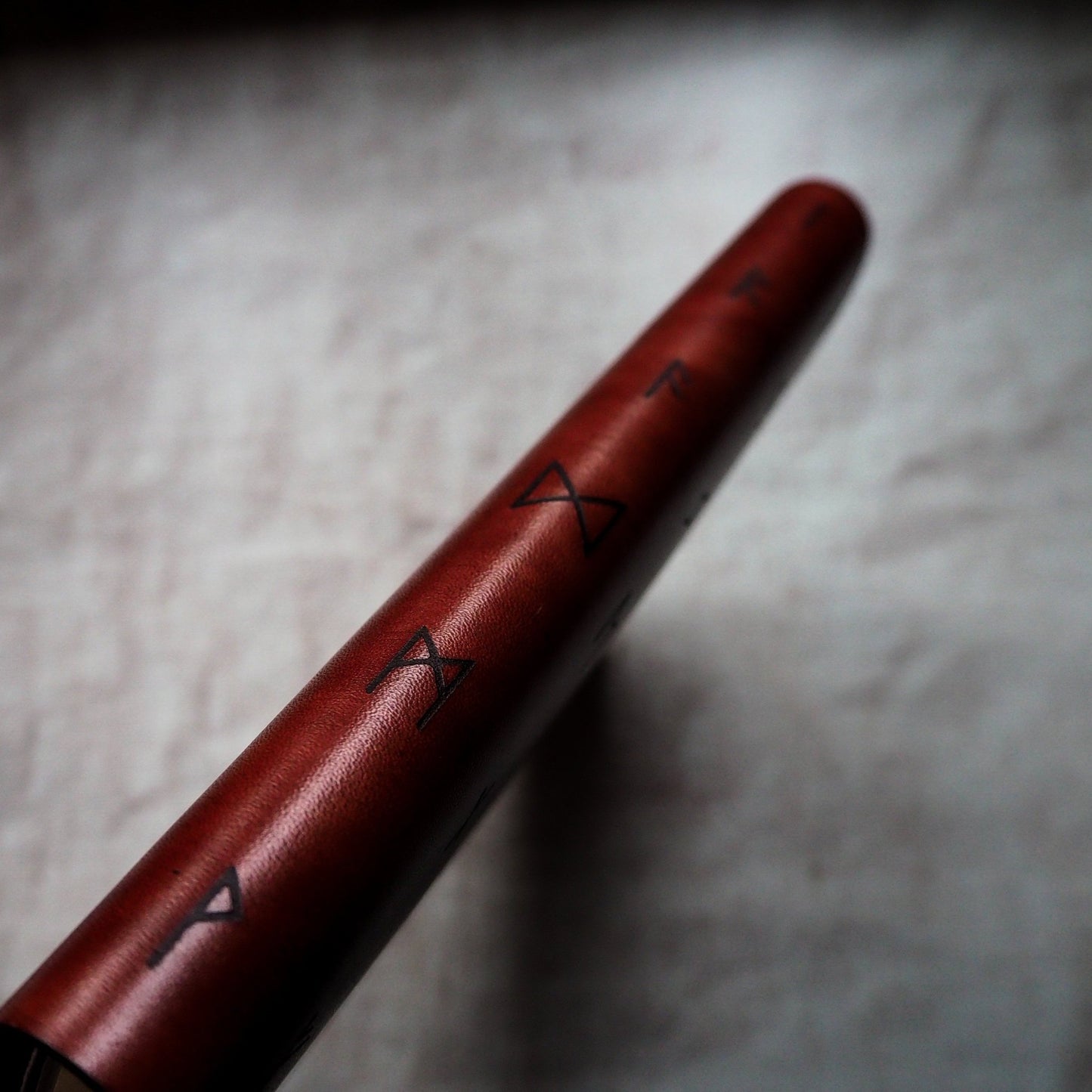 Image featuring runic alphabets on the spine of the Rune leather notebook cover by HÔRD.