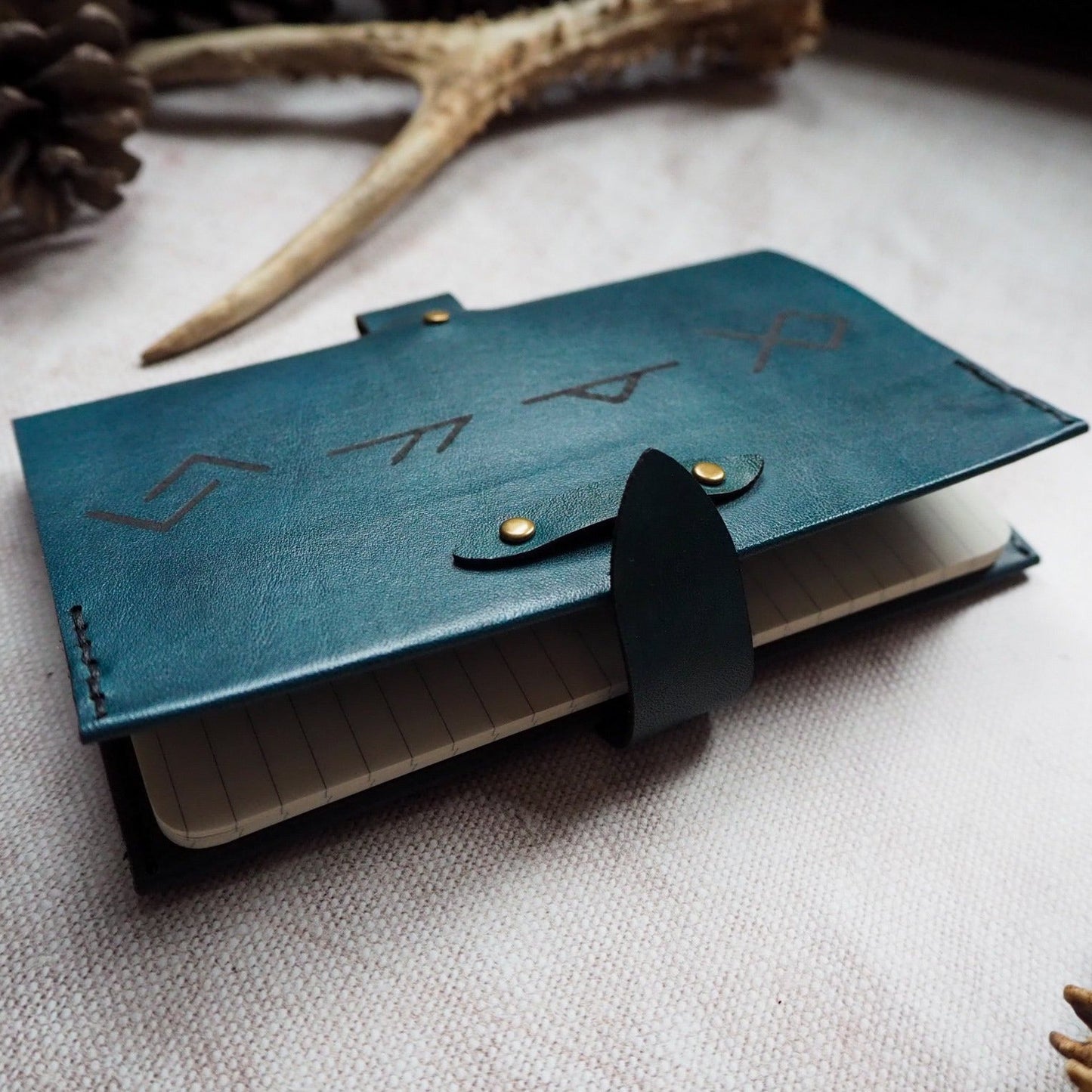 The Viking Rune Pocket Journal that has been bound onto a Moleskine Cahier.