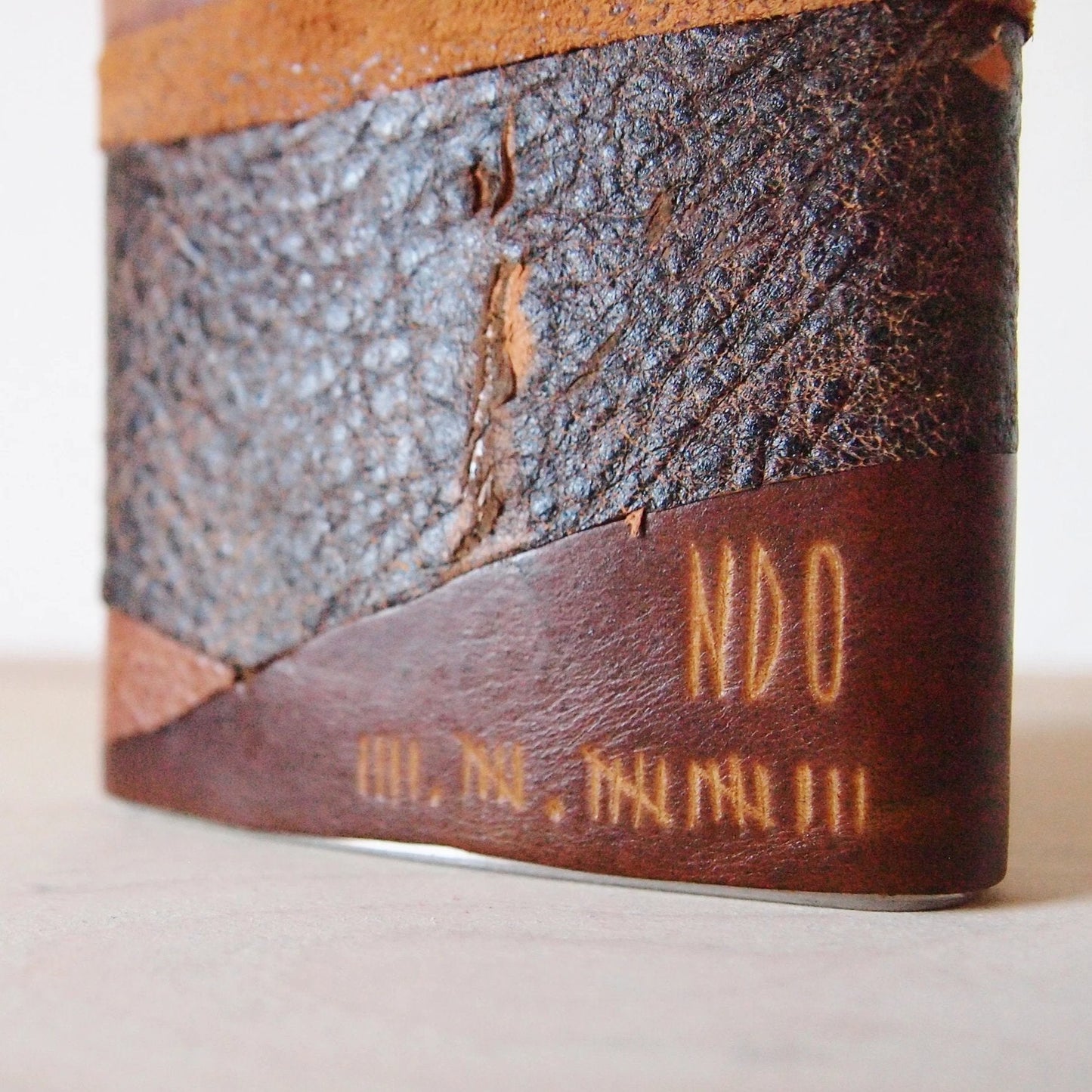 Closer look at the engraving of the custom personalisation of the rum hip flask.