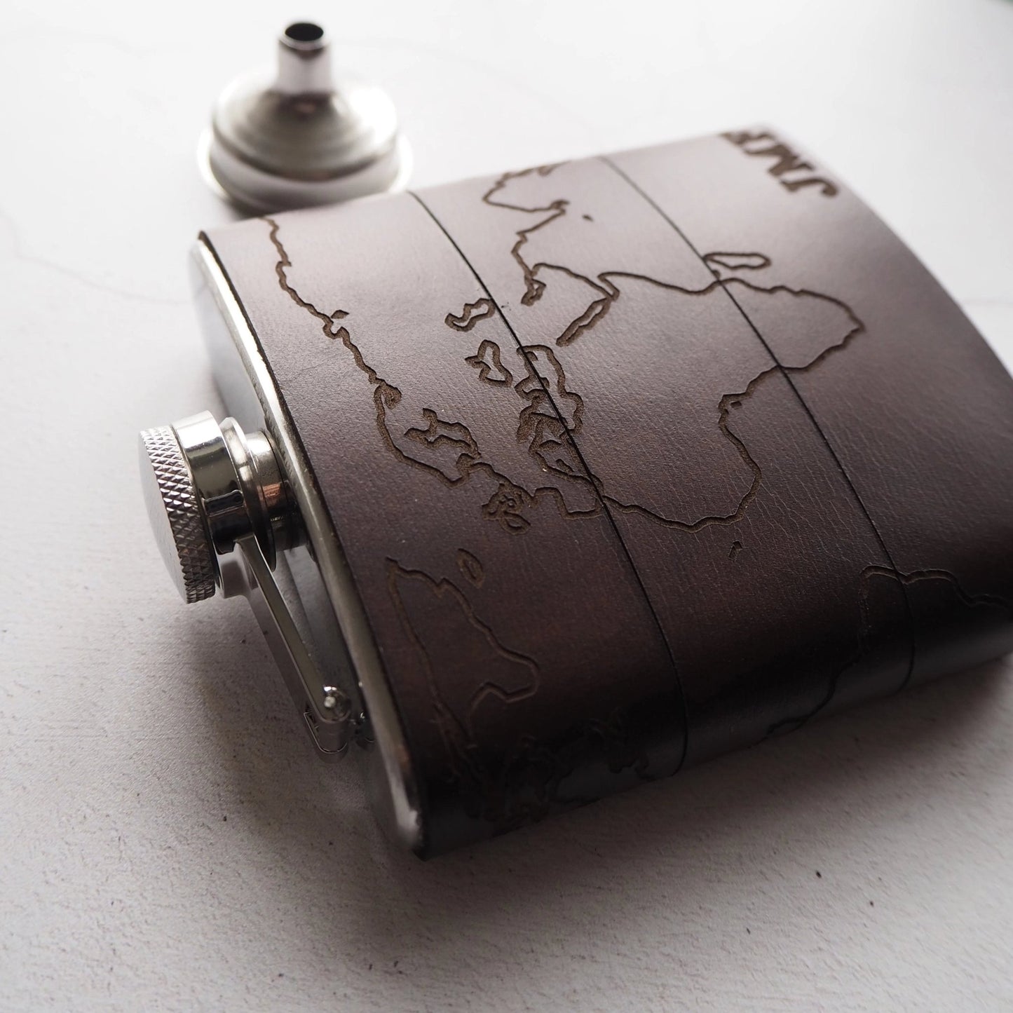 This Map Hip Flask comes with a funnel.