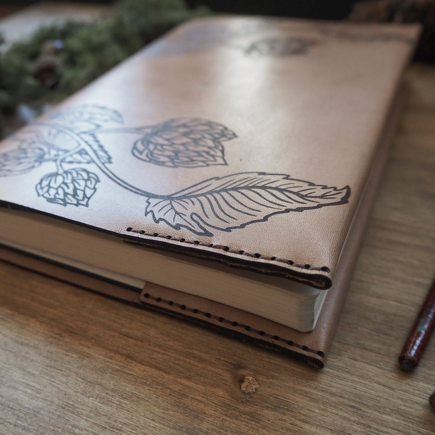 Close-up view of the hand-stitch on the Beer Journal by HÔRD.