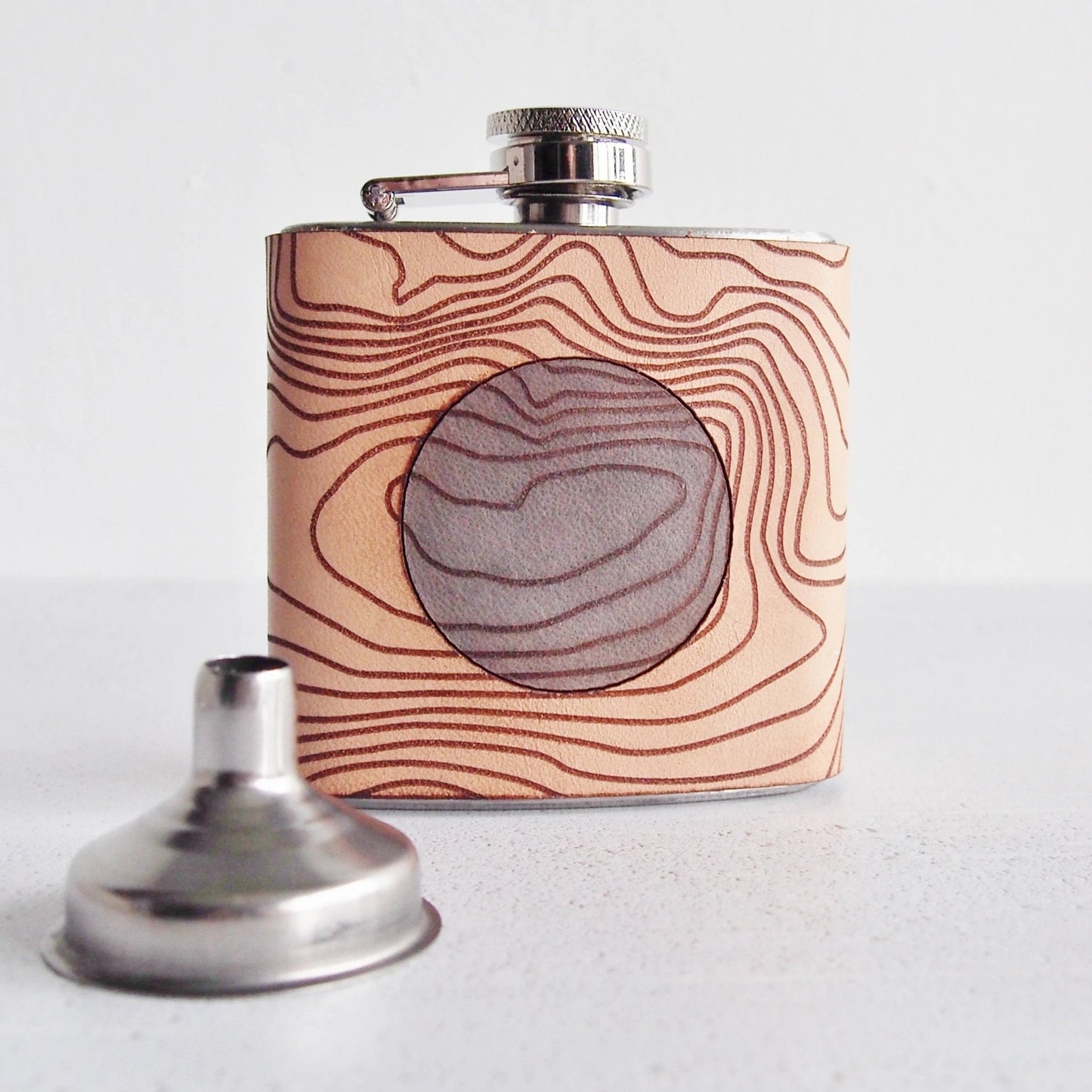 This Scottish Flask comes with a funnel.