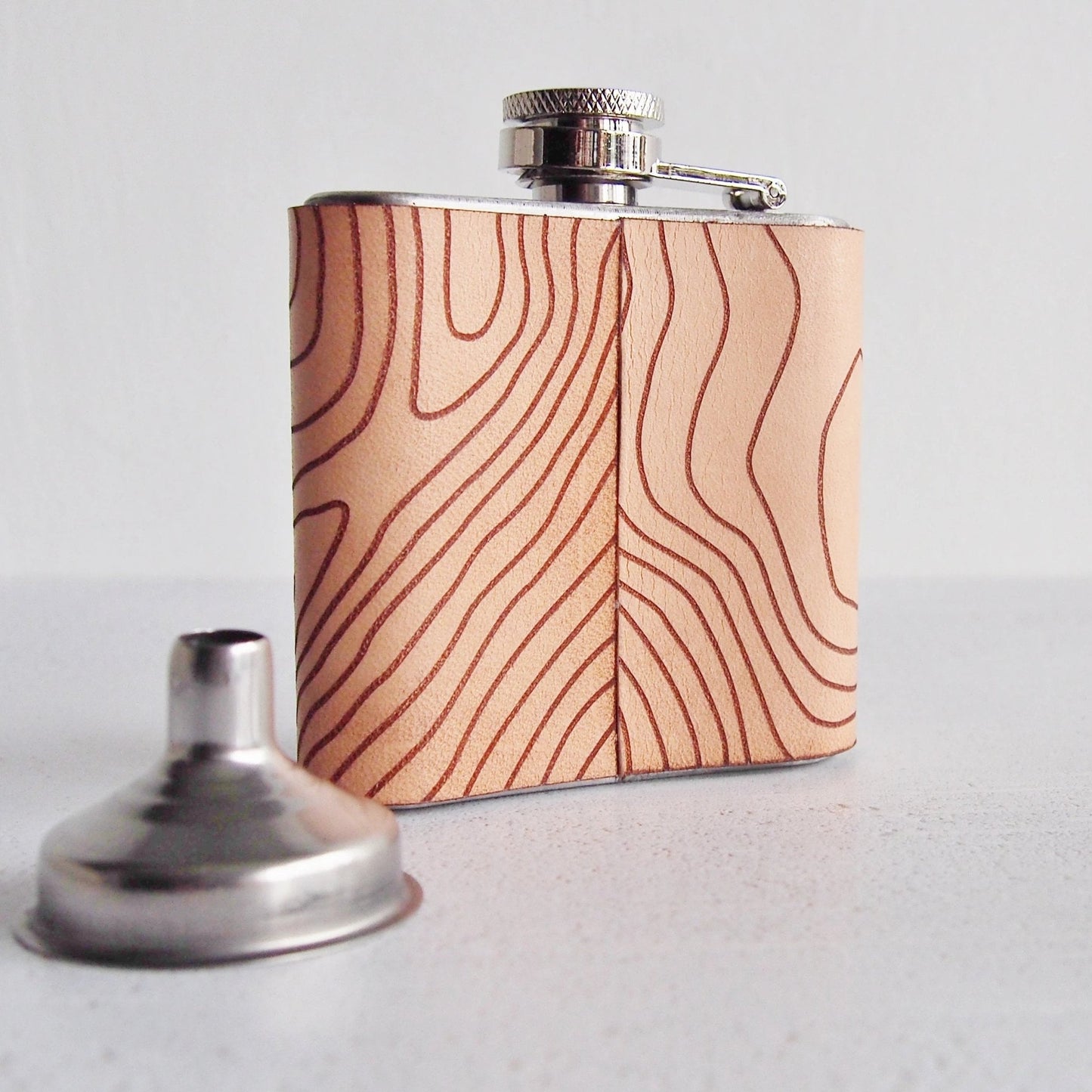 Posterior view of the Scottish Flask along with a funnel.