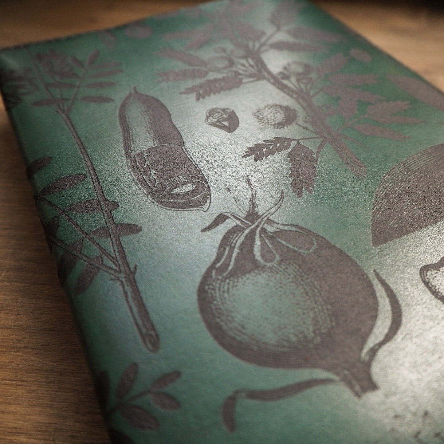 Close up of the nature inspired engravings on the back of the Garden Journal.
