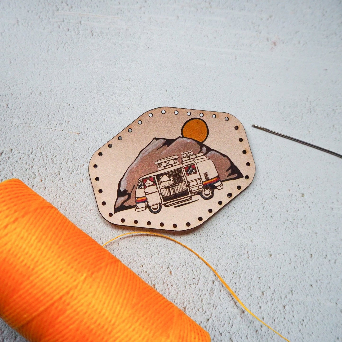 This van patch is engraved with a campervan and hand painted.