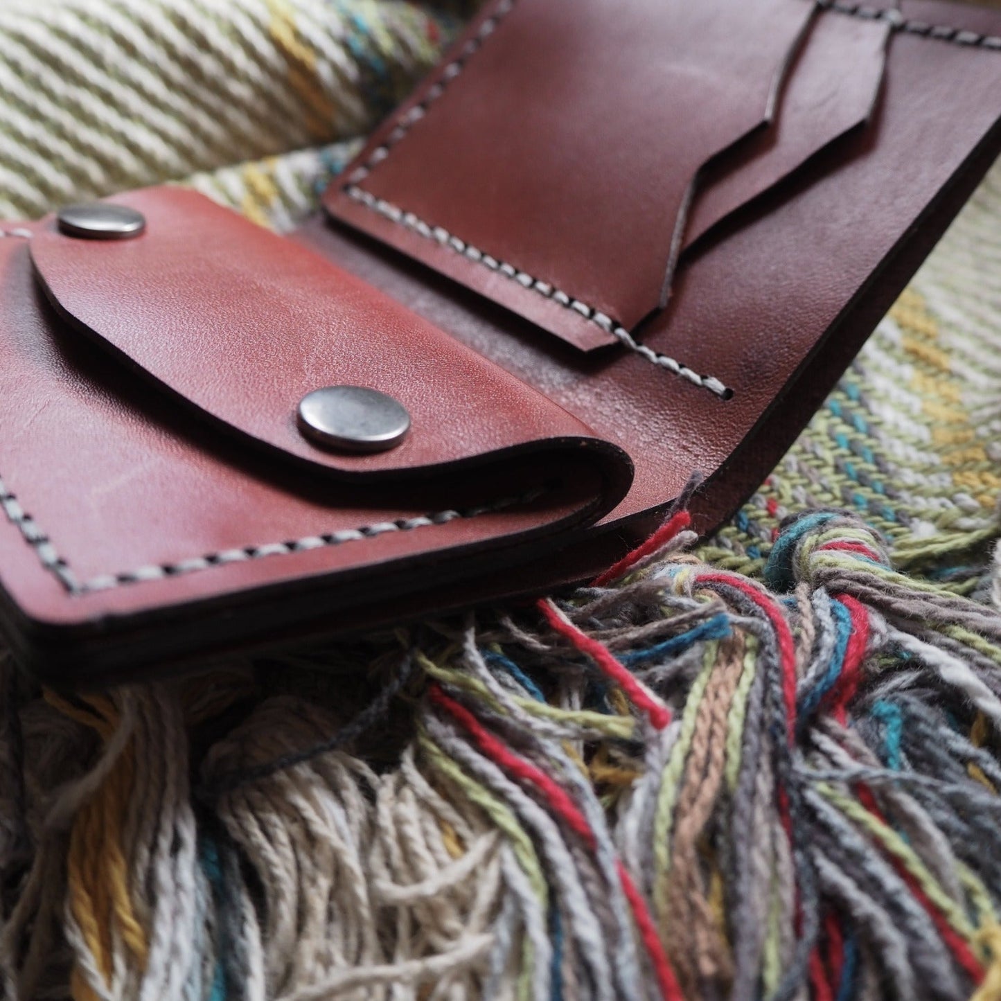 The Compact Mountain Purse has been hand stitched with white linen thread for durability.
