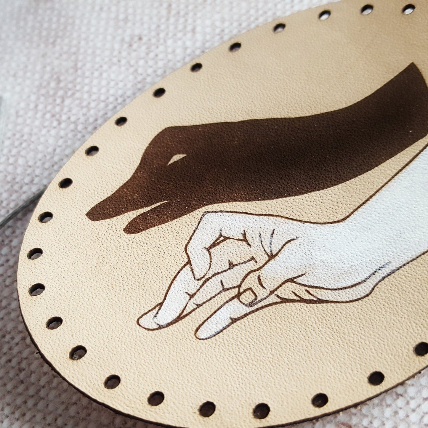 A close up of the hand painted Goose Patch from HORD, showing the texture of the grain of the leather