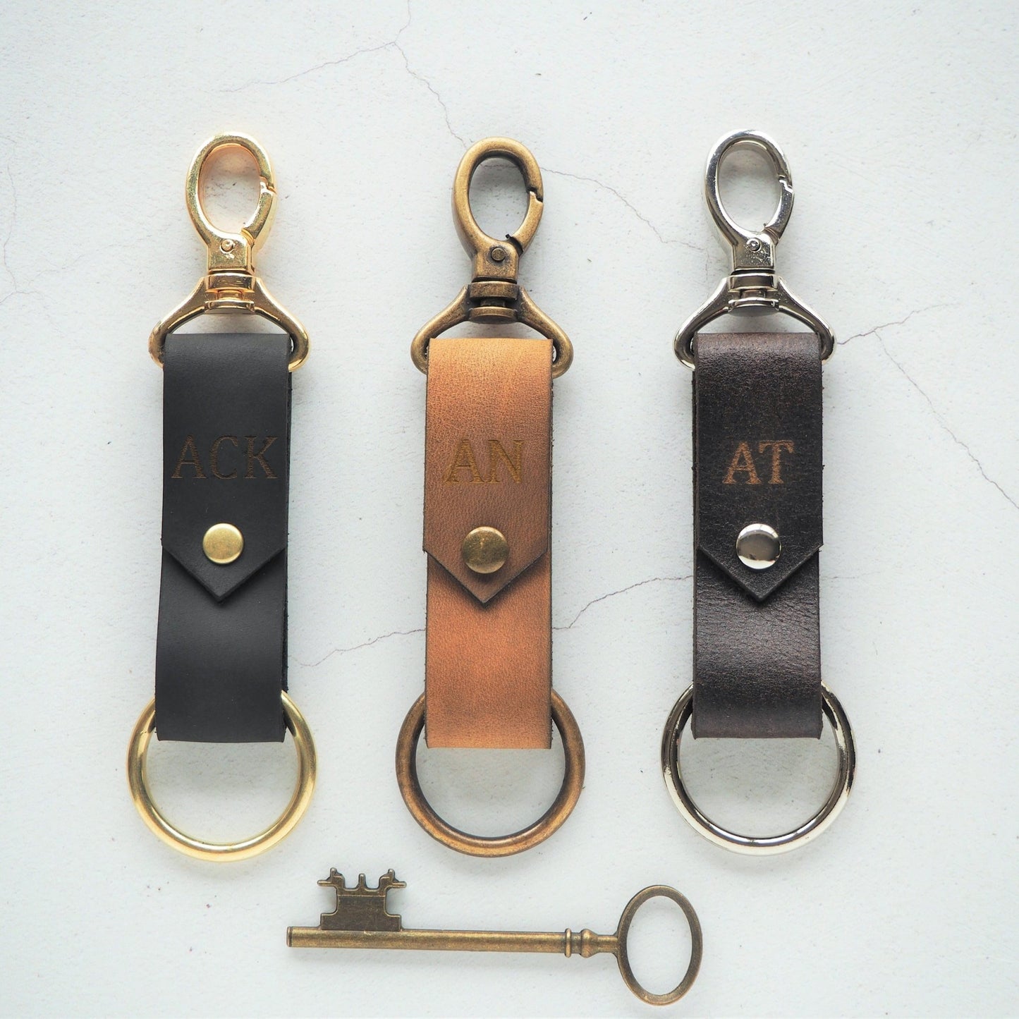 The Halda Leather Key Fob in three different leather colours and hardware material.