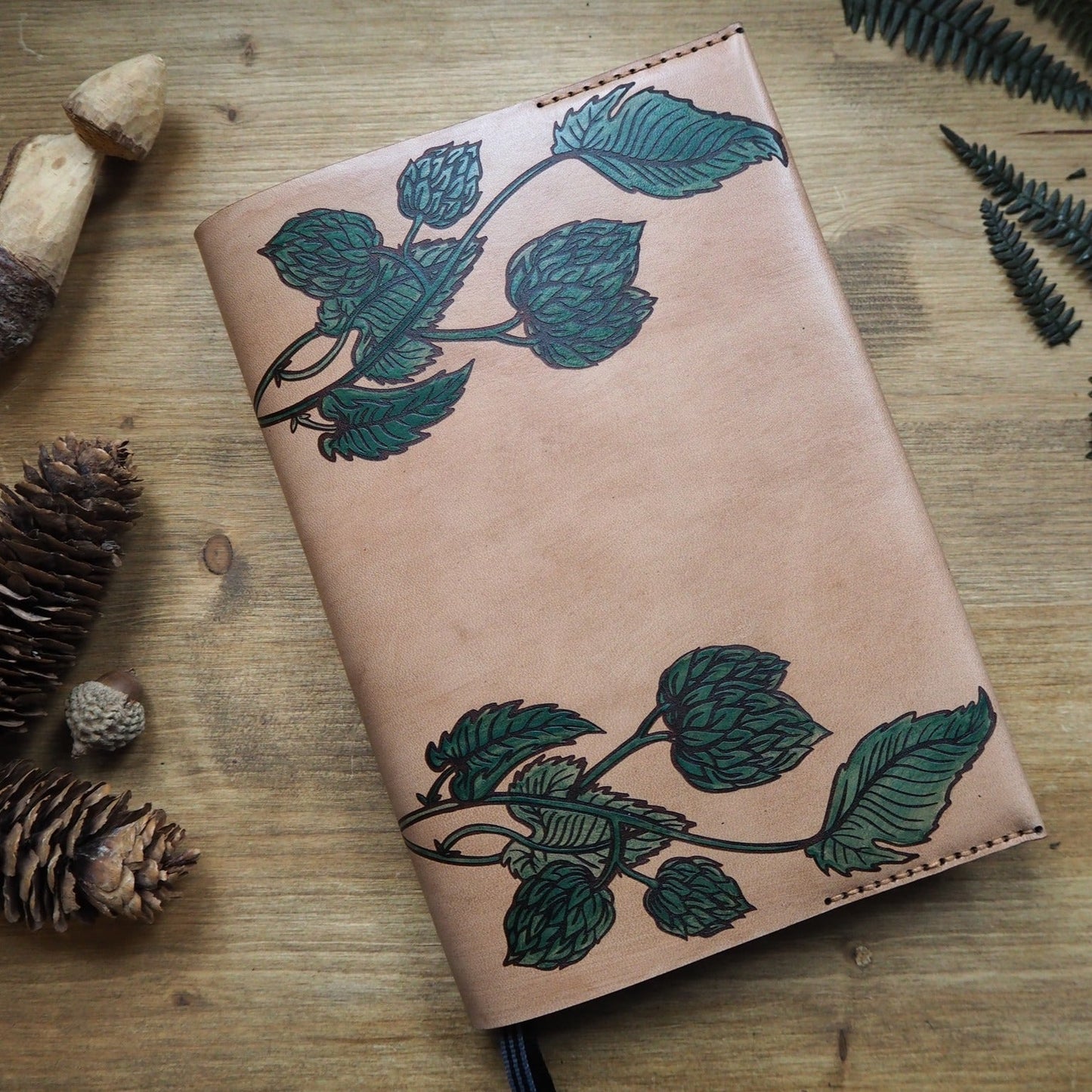 The perfect beer log book, a hand dyed journal cover engraved with hop vines which are hand painted in green dye, by HÔRD.