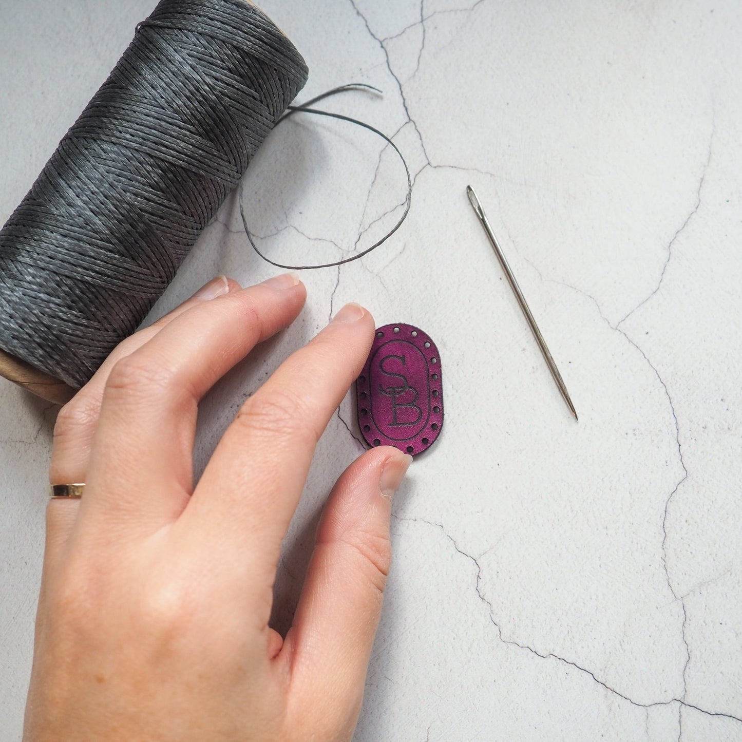 This monogrammed patch is engraved with a custom initial and hand dyed.