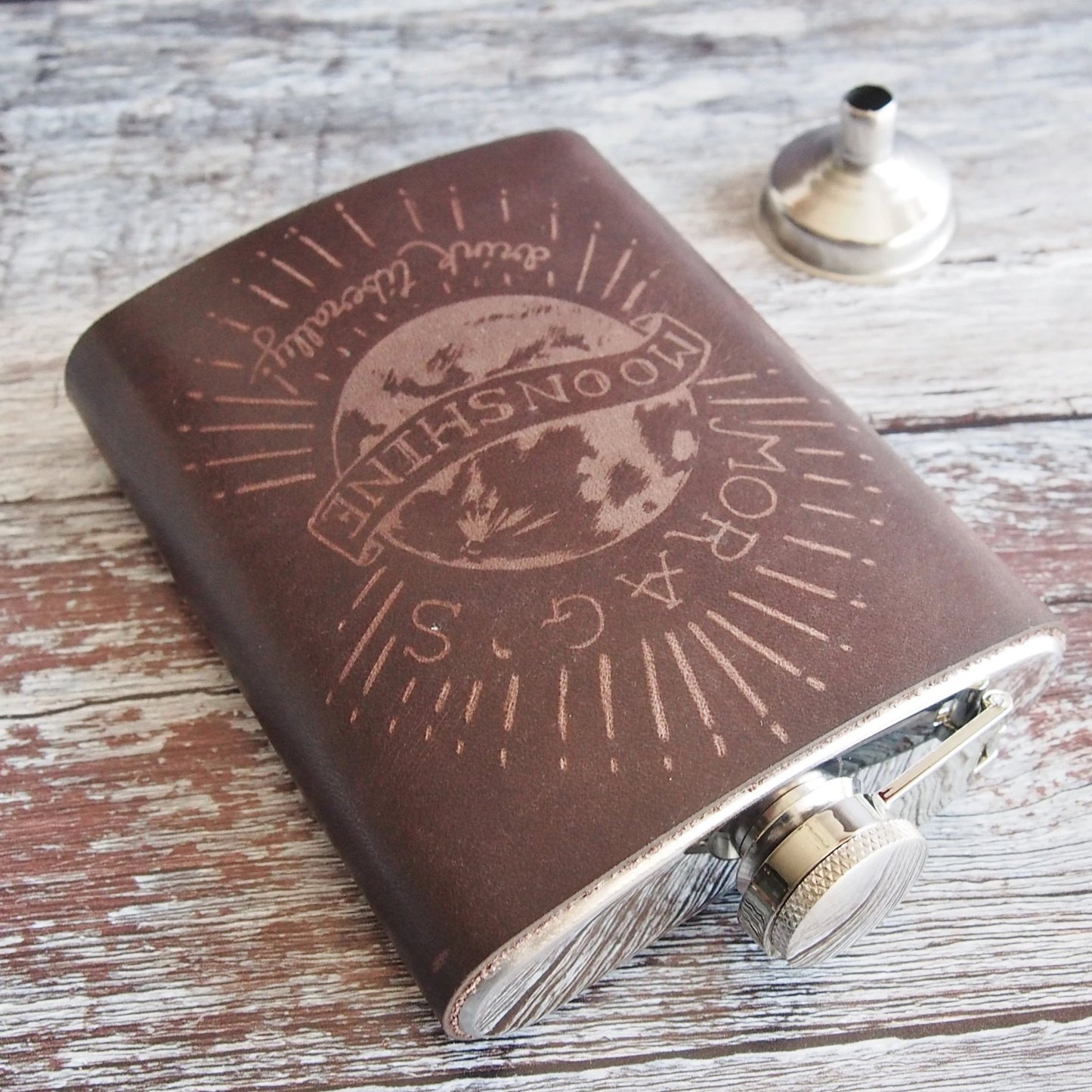 This Moonshine Flask is made from luxurious leather and clad onto a stainless steel flask.