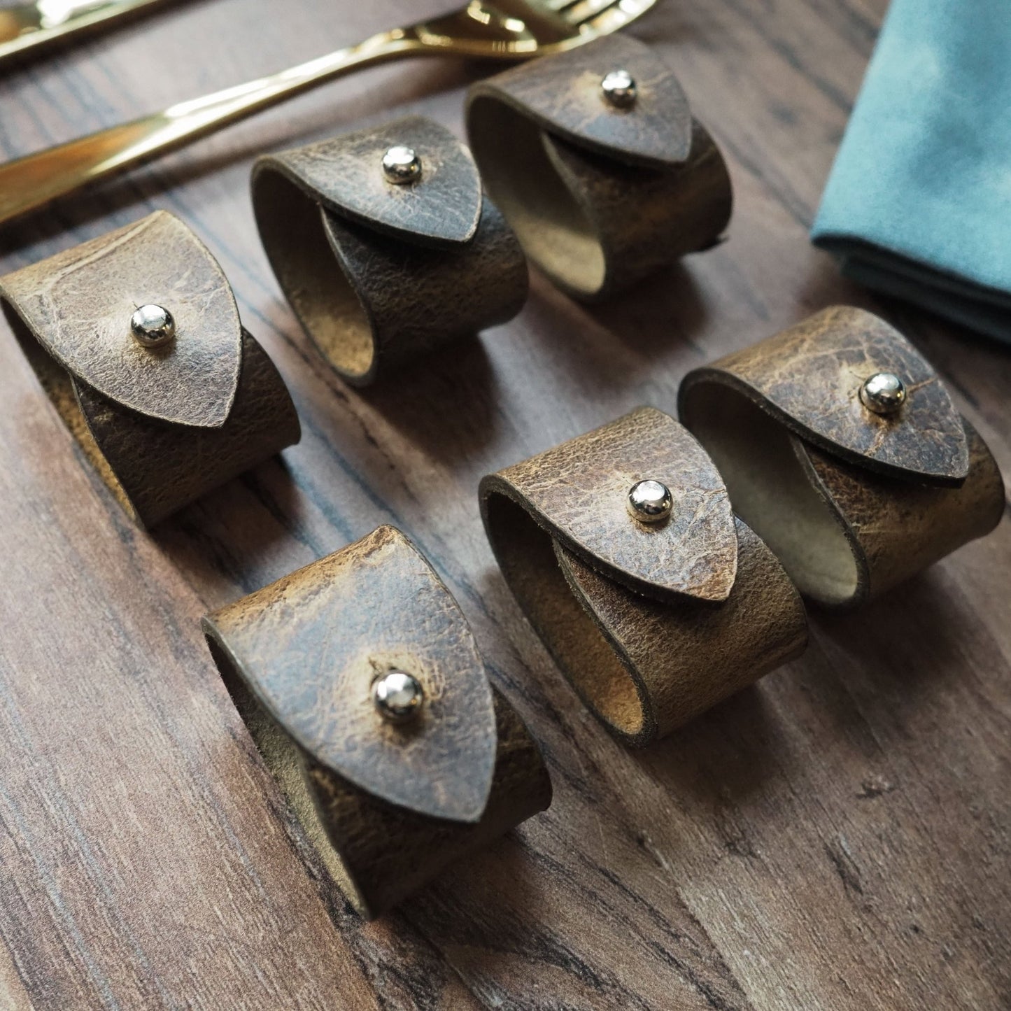 Close-up view of the Oak Napkin Ring showcasing the leather details, leather napkin rings from Hord.