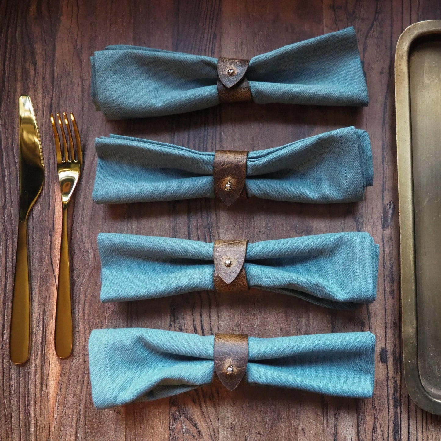 Oak Napkin Rings in pack of 4 gracefully holding 4 napkin rings, leather napkin rings from Hord.