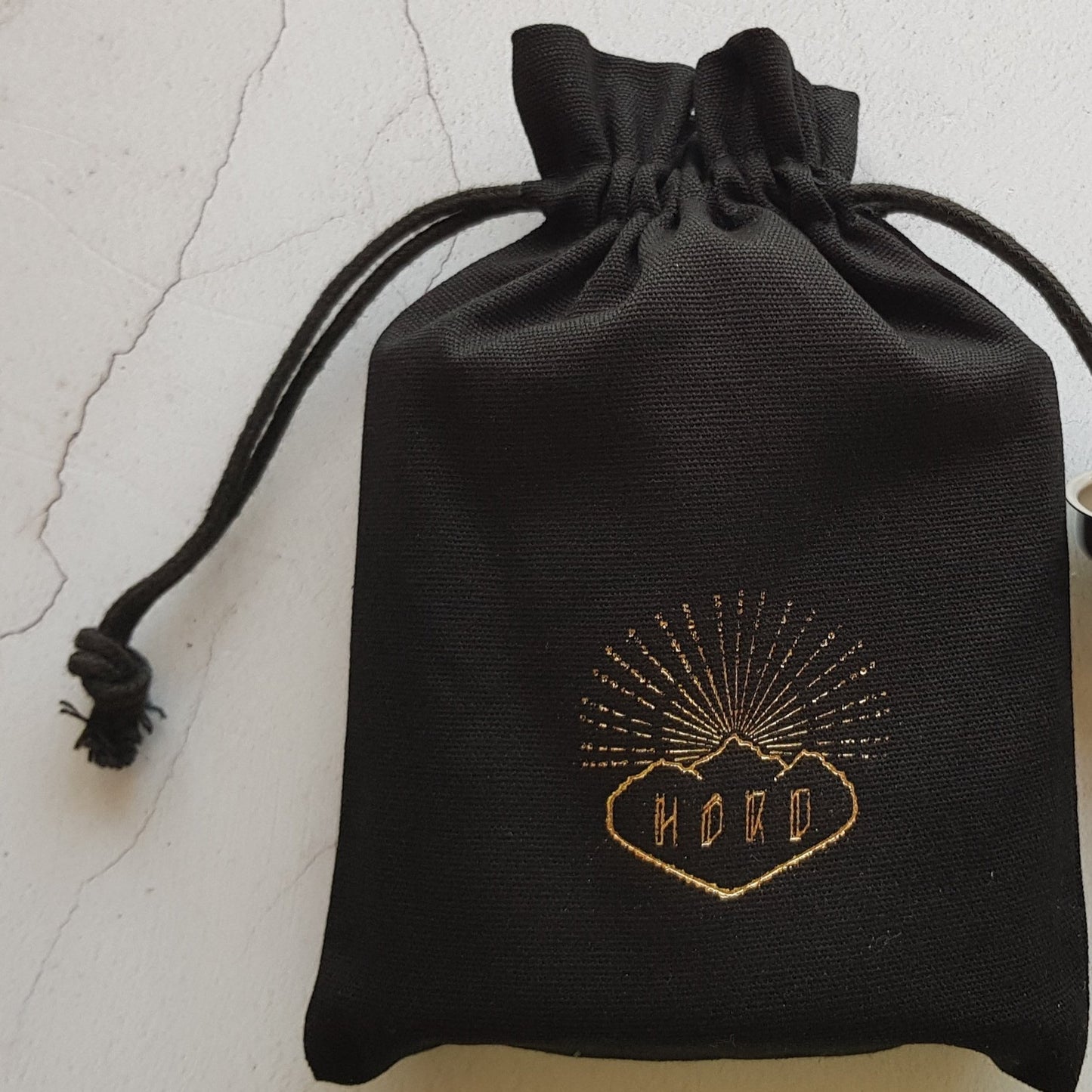 Linen bag packing for the Ogham Key Fob; ready for gifting.