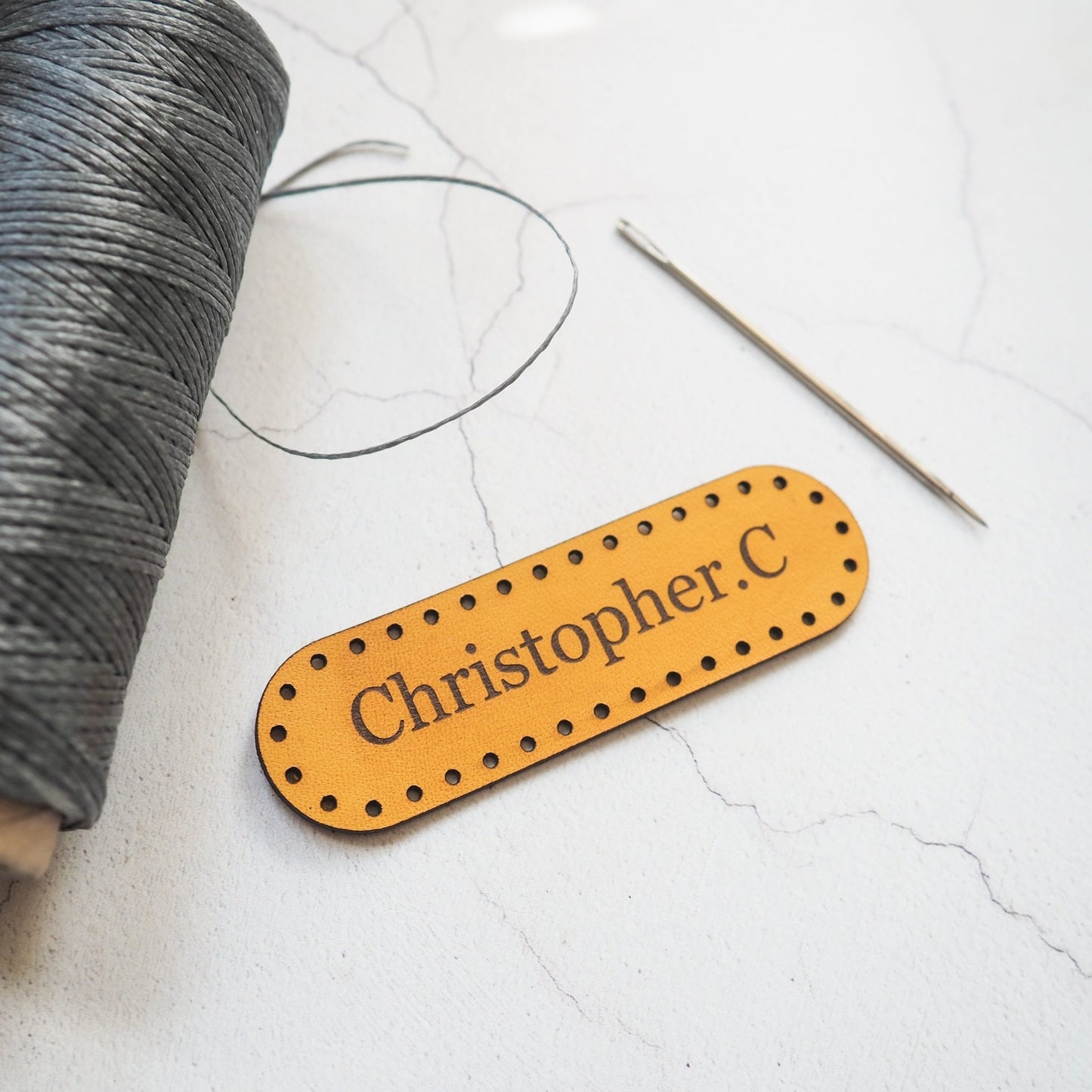 This personalised leather patch from Hord comes with pre-cut stitch holes for ease of stitching