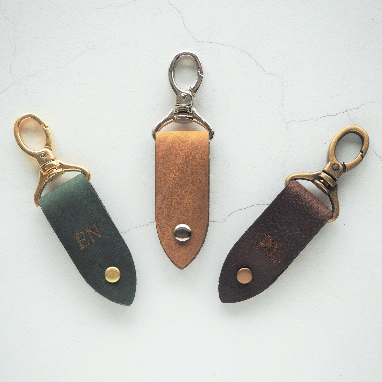 The Rof Leather Key fob in different leather colour, hardware colour, and custom personalisation.