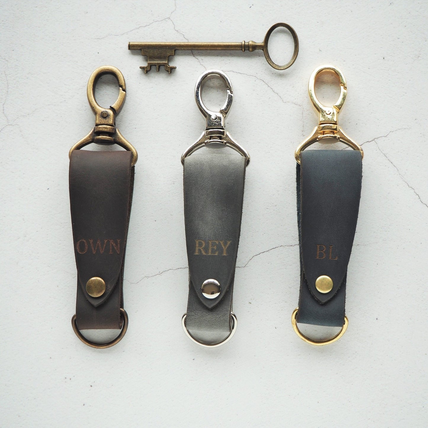 The Skor Leather Key fob engraved with custom initials.