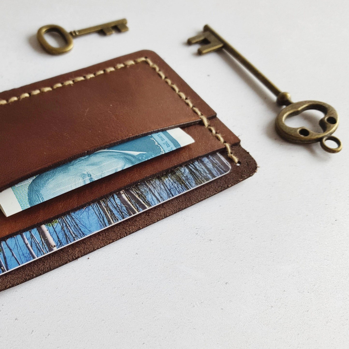 This handmade leather card holder is made in your choice of leather colour and stitch colour.