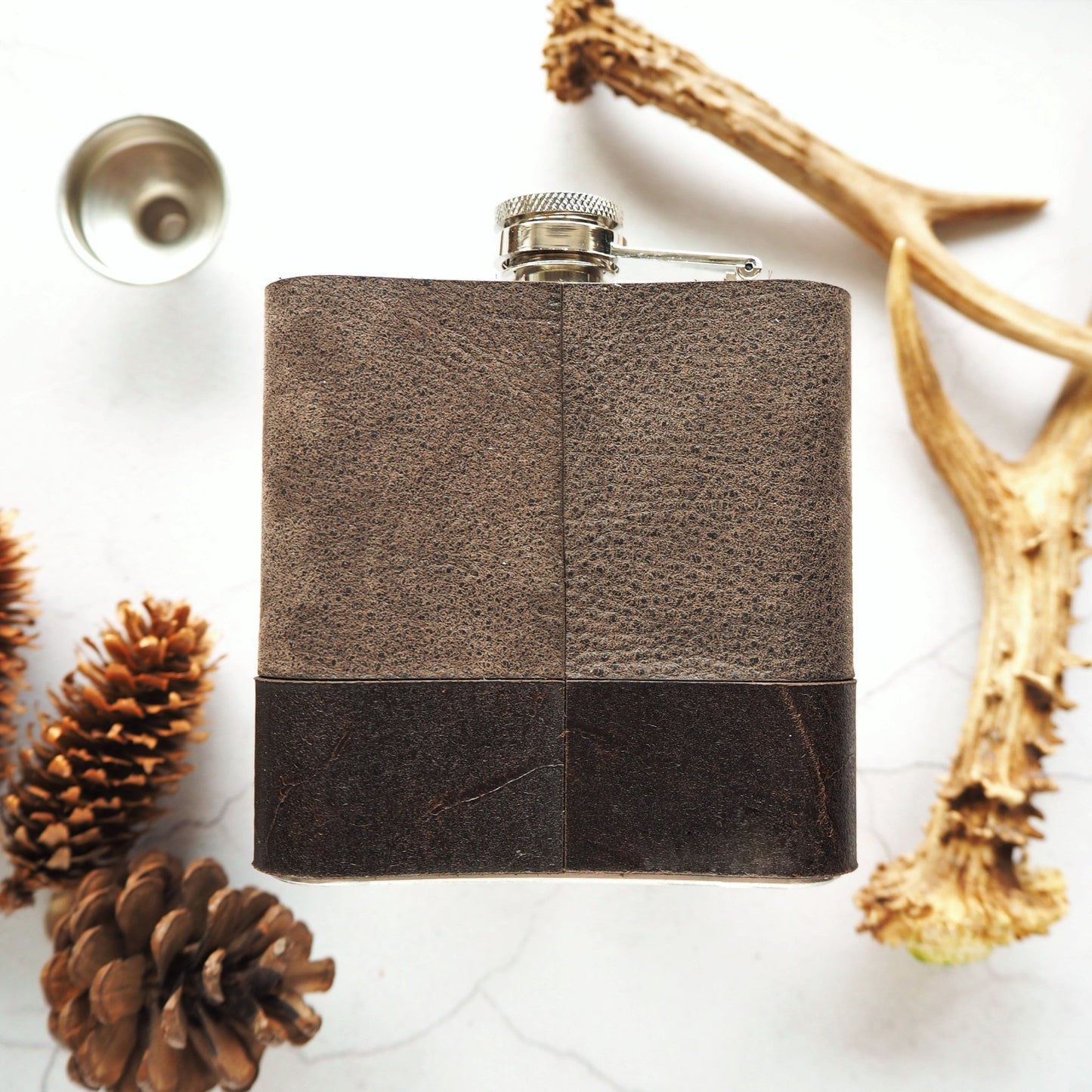 Posterior view of the monogram hip flask.
