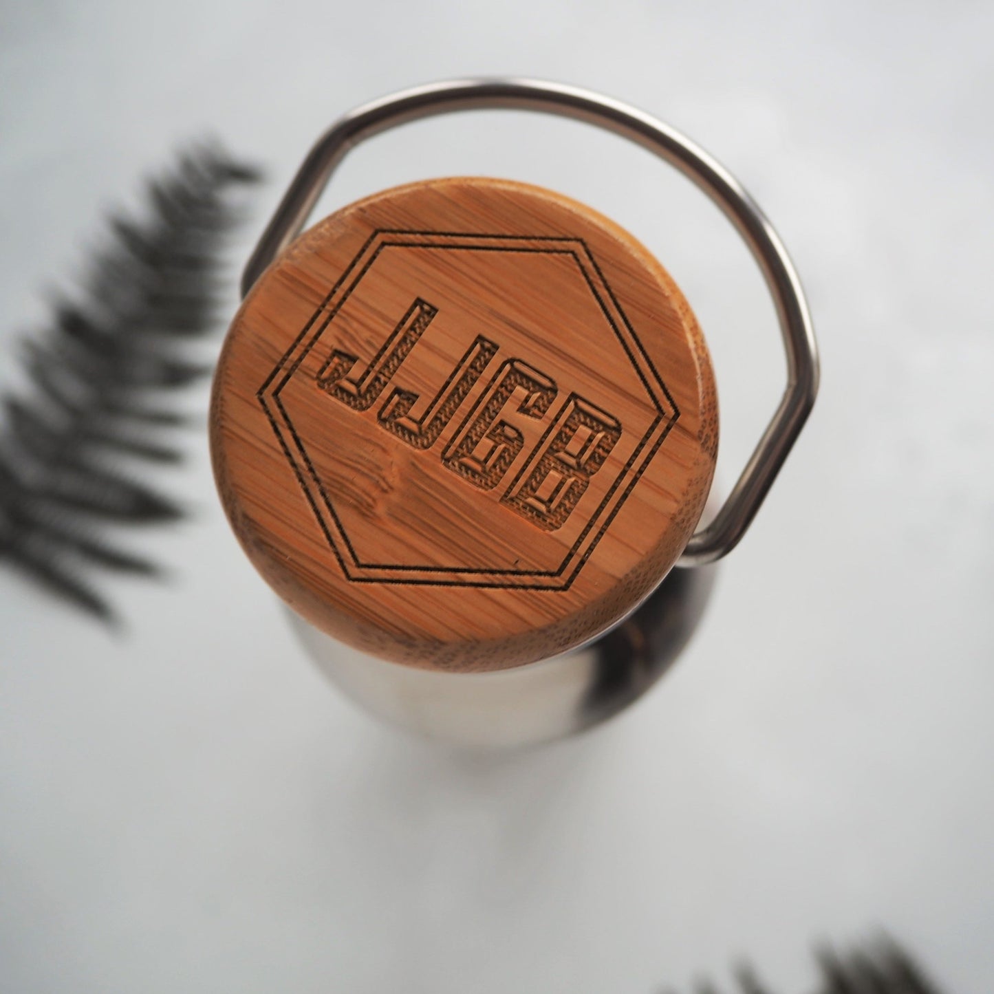The bamboo lid of the steel adventure insulated bottle can be customised with your choice of initials.